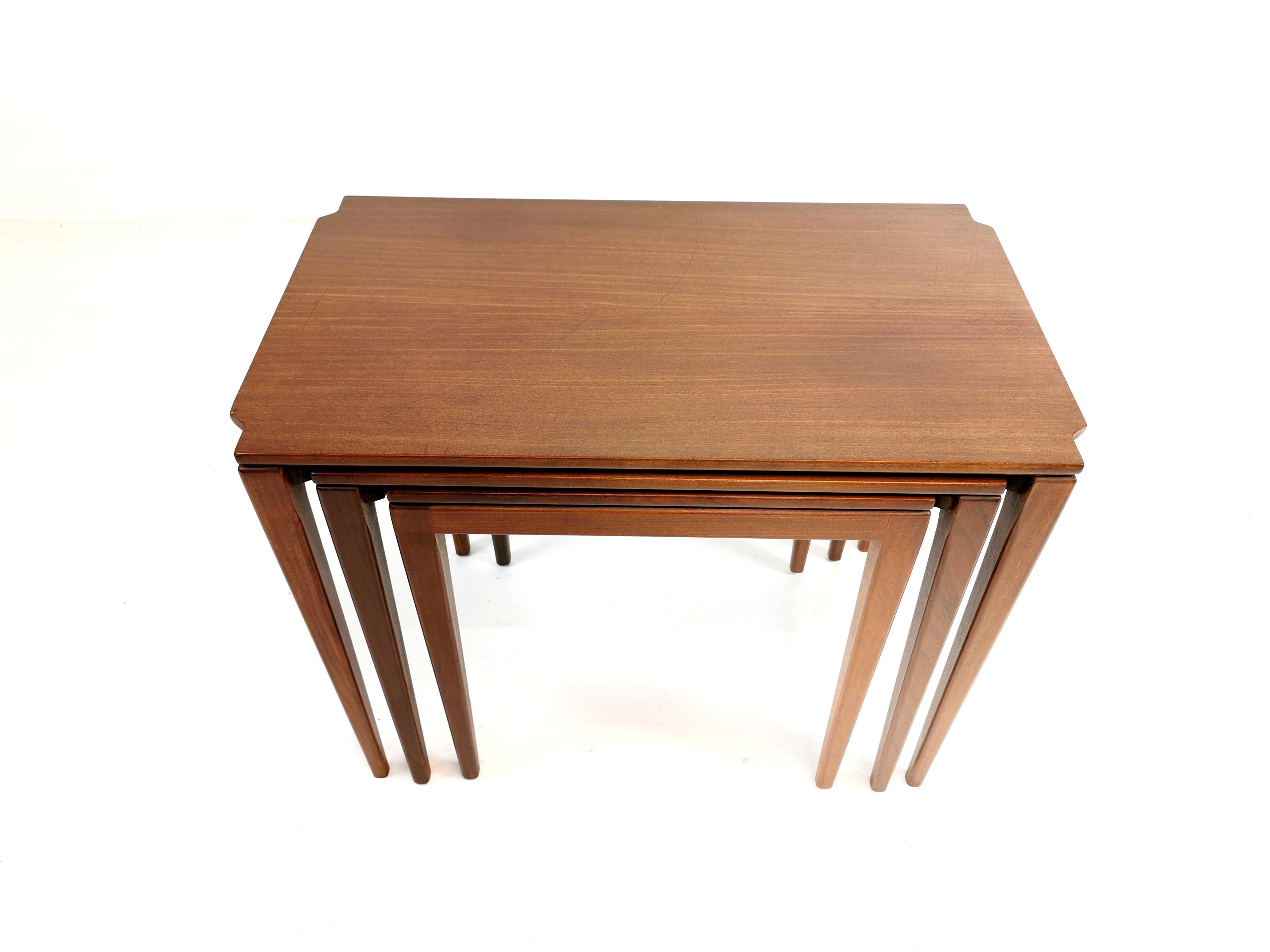Nest of 3 teak coffee tables. 

This set of tables were designed by Richard Hornby circa 1960s. His elegantly crafted furniture was manufactured by Fyne Ladye Furniture of Bath, UK.

The tables are made of Afromosia wood. Featuring Hornby