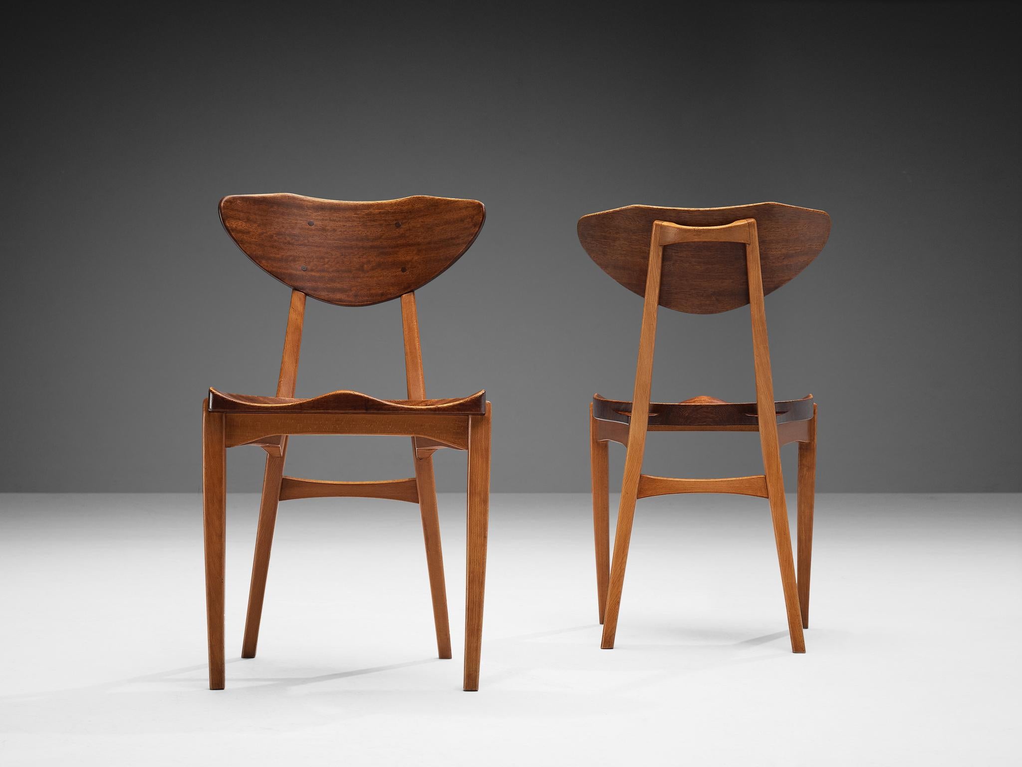 Richard Jensen and Kjaerulff Rasmussen, pair of dining chairs, mahogany, Denmark, 1960s

This striking pair of dining chairs was designed by Richard Jensen and Kjaerulff Rasmussen. What characterizes the chair is the combination of angled frame and
