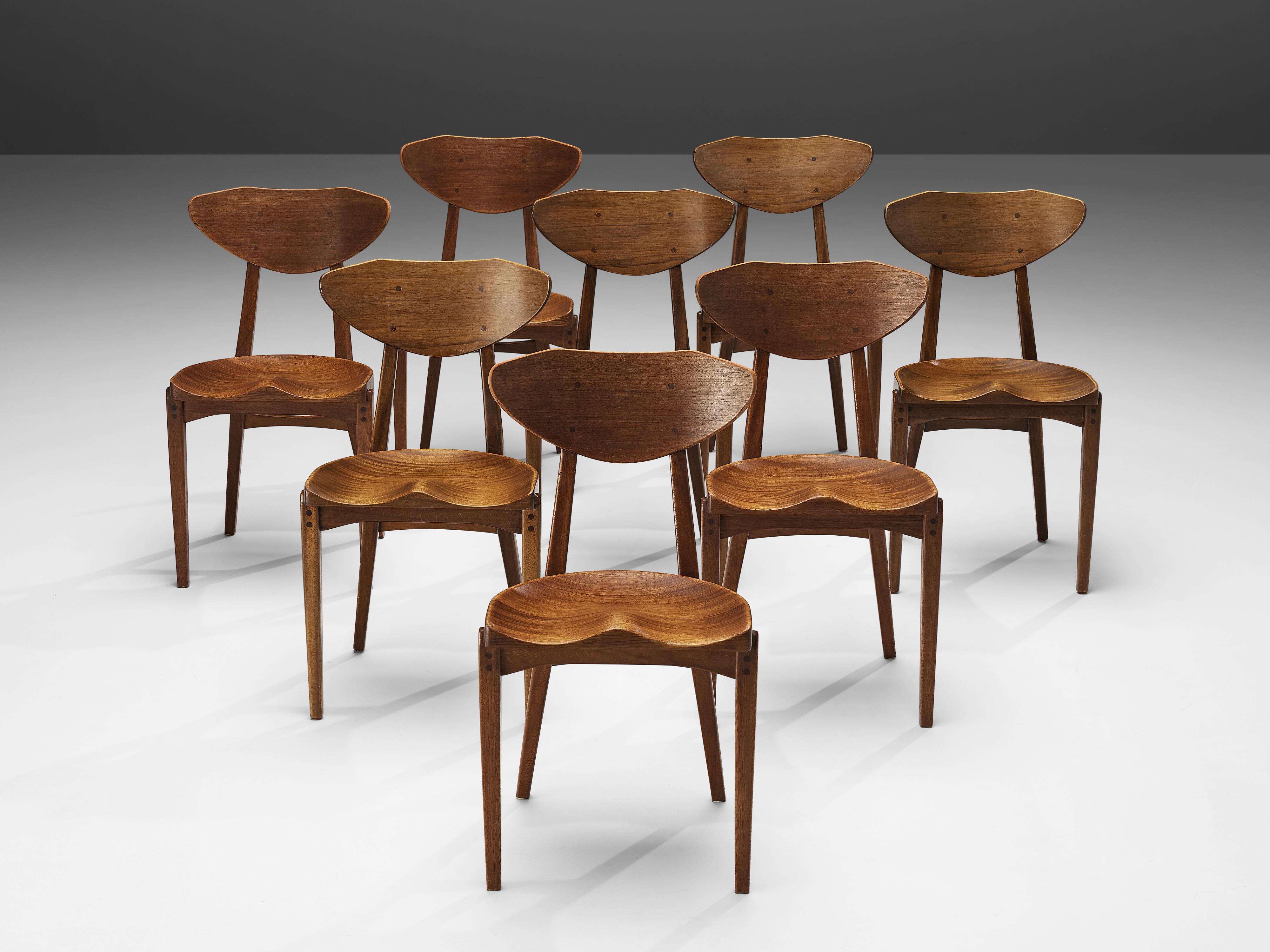 Richard Jensen and Kjaerulff Rasmussen, set of eight dining chairs, mahogany, Denmark, 1960s.

This striking set of mahogany dining chairs was designed by Richard Jensen and Kjaerulff Rasmussen. What characterizes the chair is the combination of