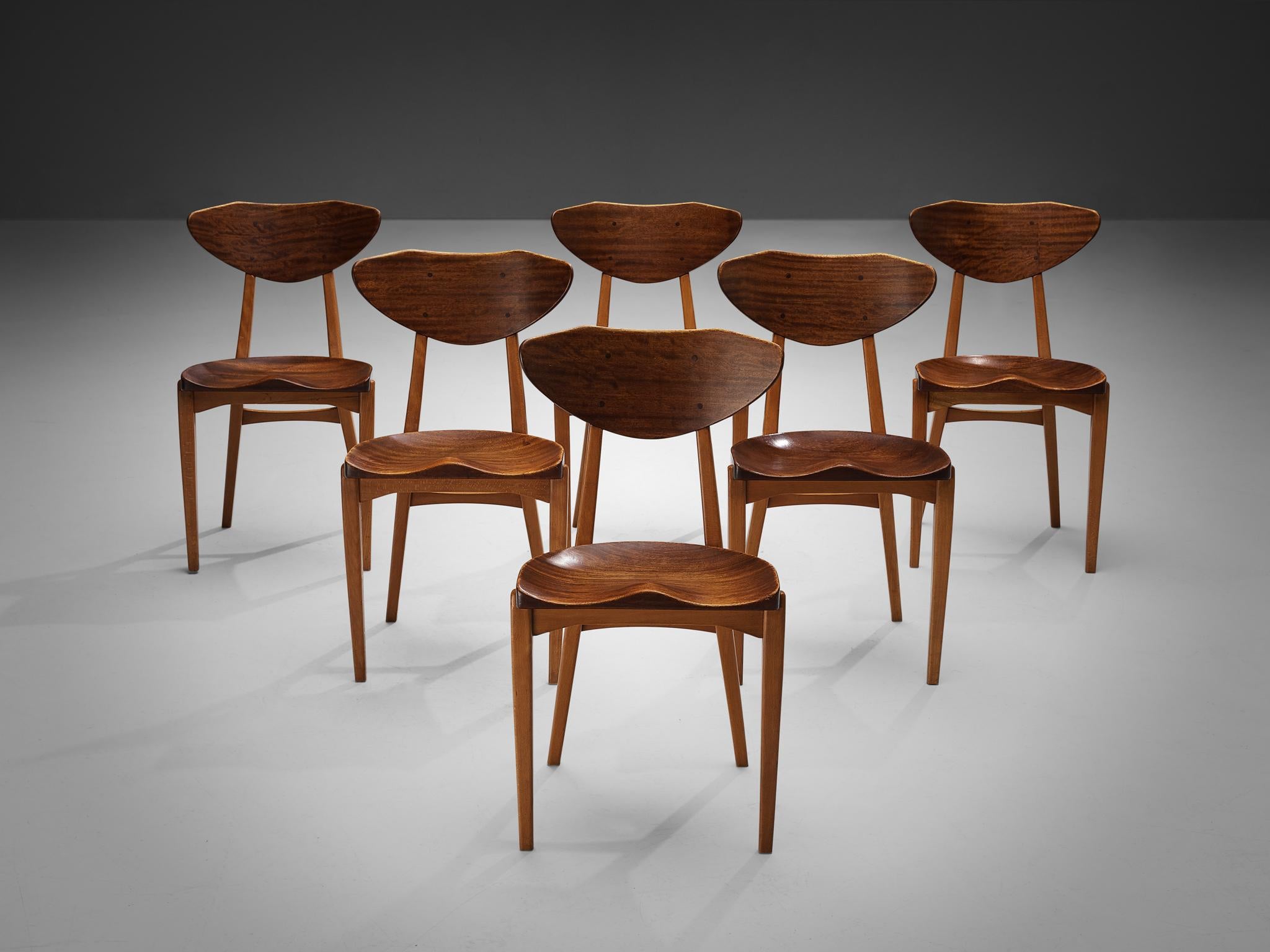 Richard Jensen and Kjaerulff Rasmussen, set of six dining chairs, mahogany, oak, Denmark, 1960s

This striking set of dining chairs was designed by Richard Jensen and Kjaerulff Rasmussen. What characterizes this set of chairs is the combination of