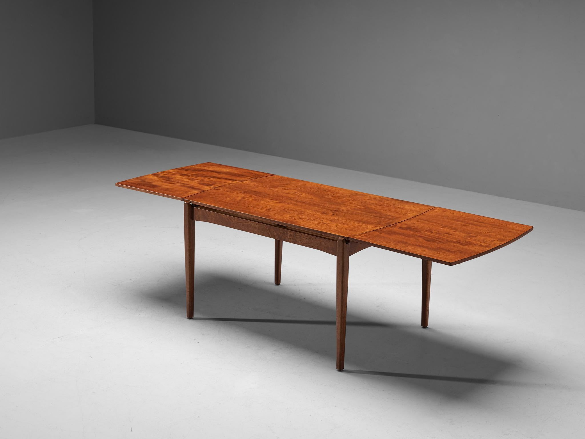 Richard Jensen & Kjaerulff Rasmussen for A. Hansen & Søn, extendable dining table, teak, Denmark, 1950s. 

This extendable dining table designed by Richard Jensen & Kjaerulff Rasmussen is characterized by a strong and solid construction executed in