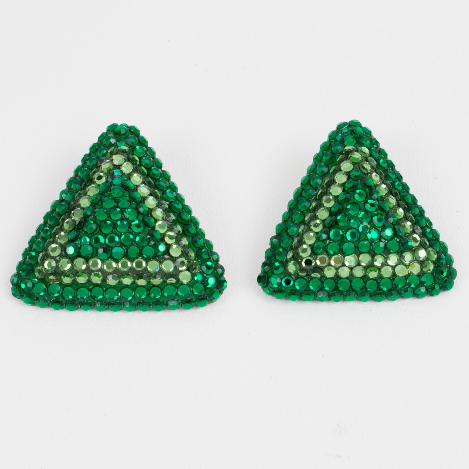 Richard Kerr created these lovely statement clip-on earrings in the 1980s. They are made up of his signature pave rhinestones. The earrings feature an oversized triangle shape, all covered with colorful crystal rhinestones on a green resin