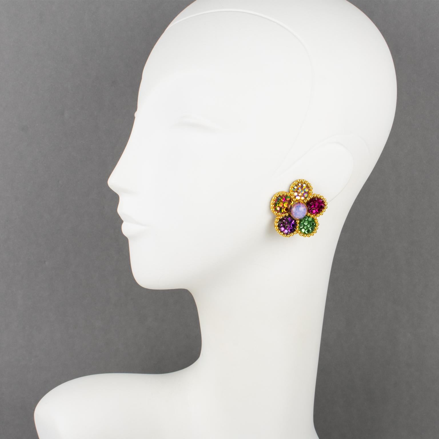 Richard Kerr designed this so lovely statement clip-on earrings in the 1980s. They are made of his signature pave rhinestones. 
These pieces feature a dimensional floral gilt metal framing with texture topped with multicolor crystal rhinestones. The