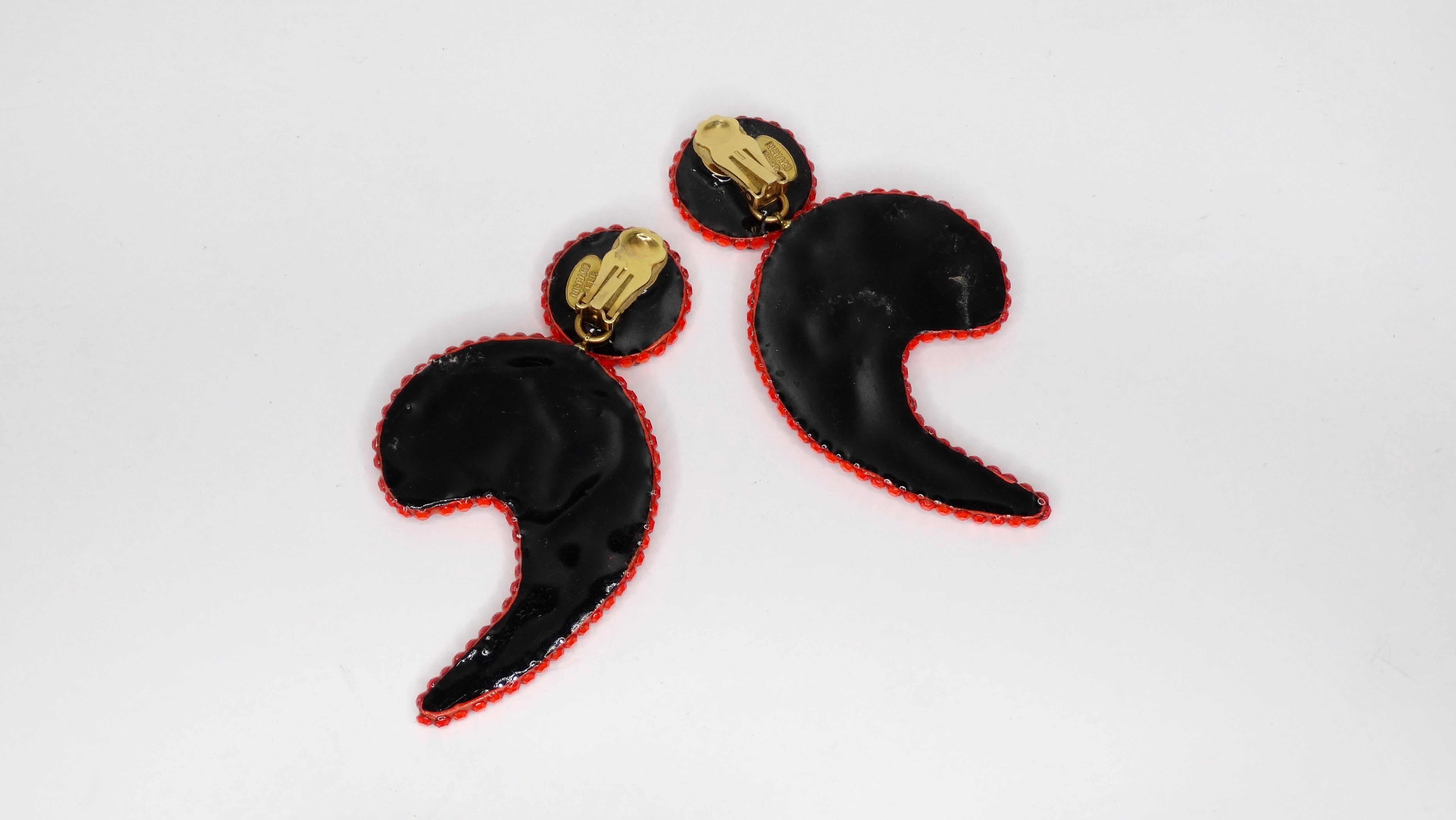 The most divine pair of Richard Kerr rhinestone earrings from the 1980s! Earrings feature an abstract shape embellished with red rhinestones and clip on back closures. Stamped Richard Kerr. 

The perfect accent piece to any evening or daytime look. 
