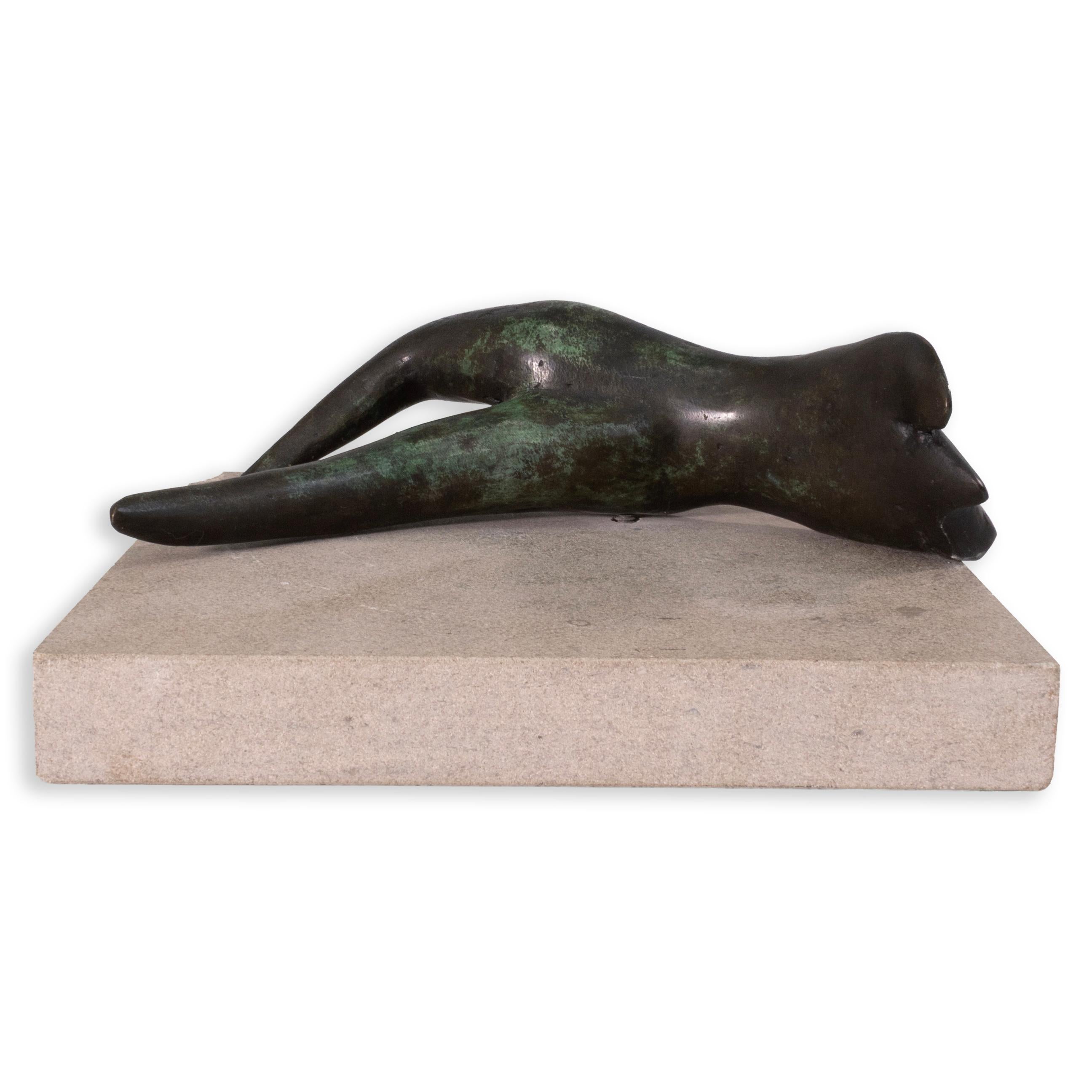 Created in 1996, this untitled bronze by Richard Kozlow depicts a reclining abstracted figure finished in a mottled green patina. Mounted on a cement base, the elongated form blends figuration with abstraction, its smooth curves suggesting both