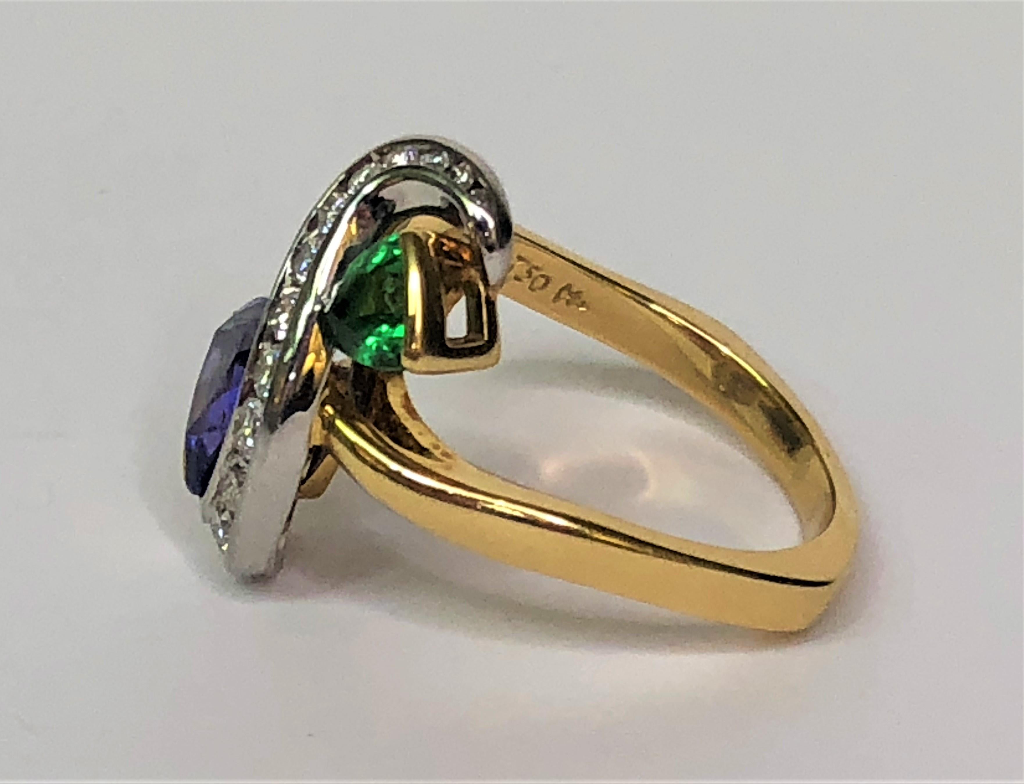 This Richard Krementz design is unique and will for sure catch attention!
18 karat yellow gold and platinum mounting.
The head of the ring is in the shape of an 's' with:
- 1 trillion cut 1.95 carat tanzanite.
- 14 round diamonds, .34tdw.
- 1
