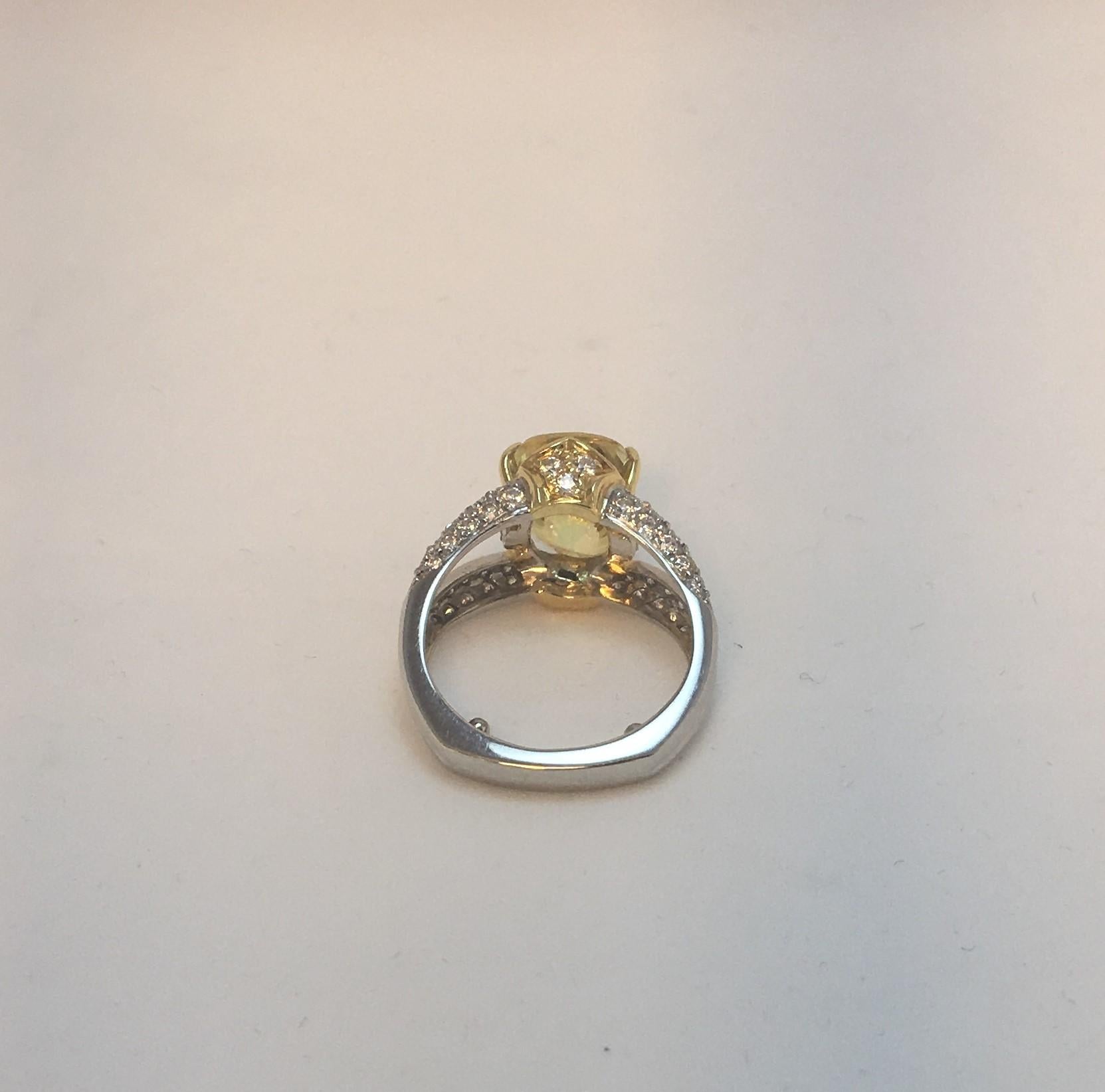 Richard Krementz Gemstones Designer
2006
Platinum and 18K Yellow Gold 
5.48 Carat Oval Natural Color Yellow Sapphire
.64 diamond total weight, round, set in shank and under yellow sapphire 
Split shank
Size 6 with sizing beads (fits like a size 5.75)
