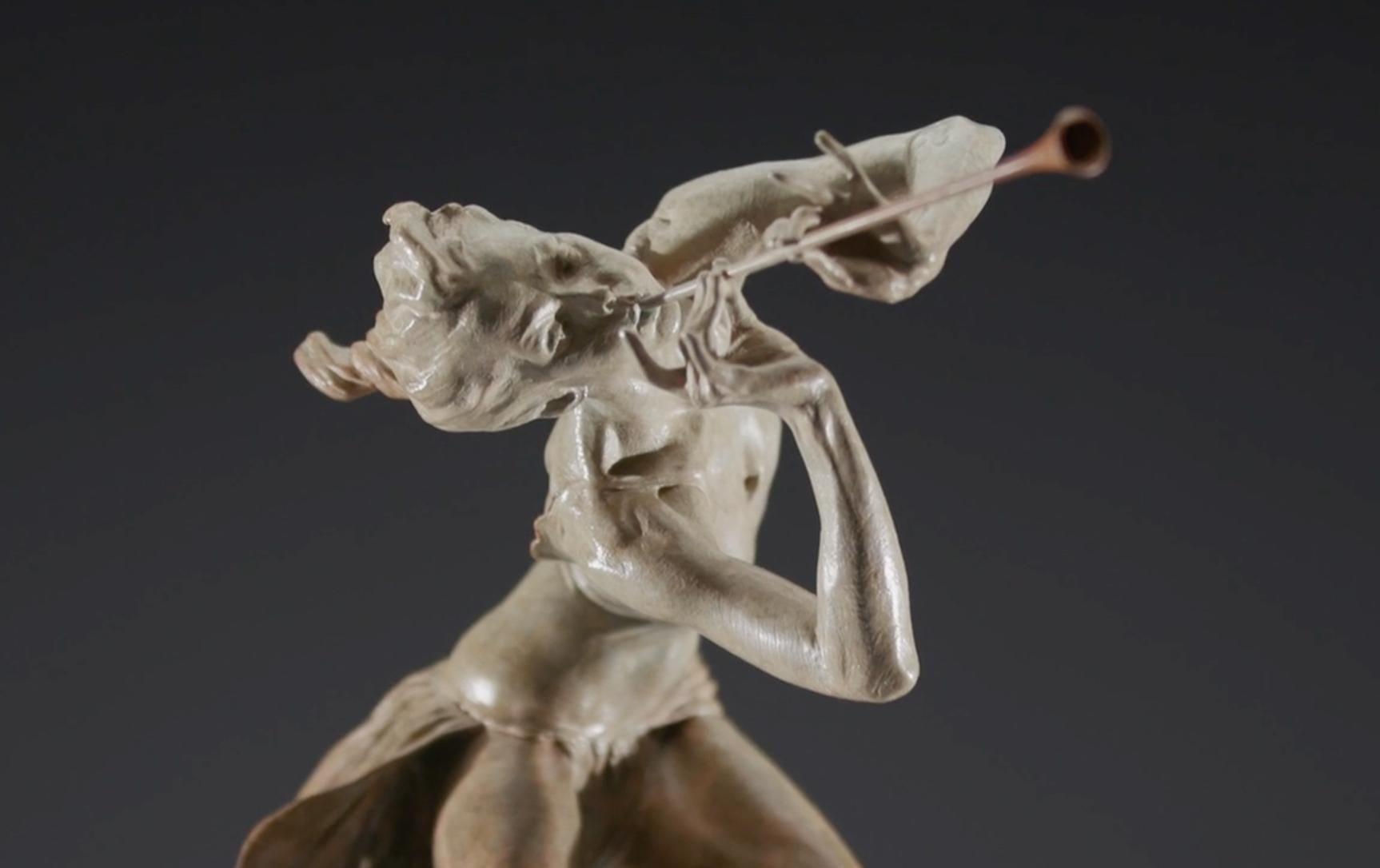 The Trumpeter represents the very embodiment of joy. With a thousand nuances of form, from her outstretched fingers to the carefree tilt of her head, she conveys a sense of youth and hope that vibrates like the imaginary notes of music she plays. It
