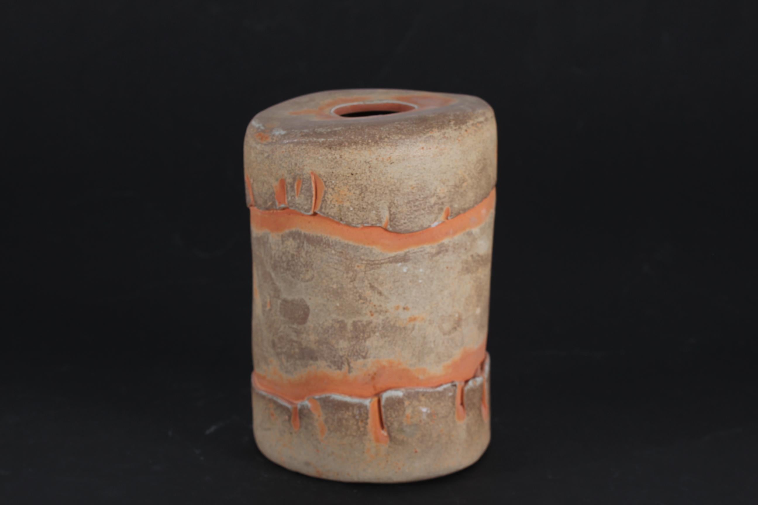 Sculptural ceramic vase made by the German-Swedish-Danish ceramist Richard Manz (1933-1999). The husband of the Danish ceramist Bodil Manz.
The rustic almost cylindrical vase is decorated with matte earthen colors

Sign. Richard Manz

Nice