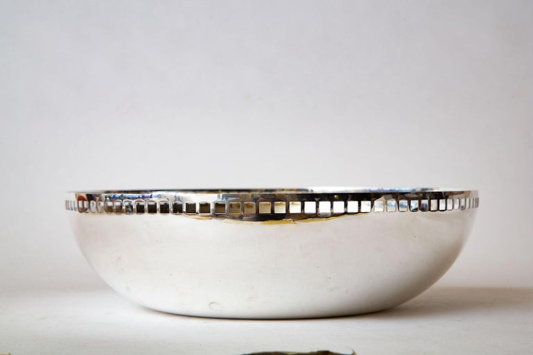 This large, commanding and modernist silver-plate bowl or centerpiece bowl is by Richard Meier for Swid Powell. It is from the skyscraper series and from the 1980s. Very postmodern. It is 14