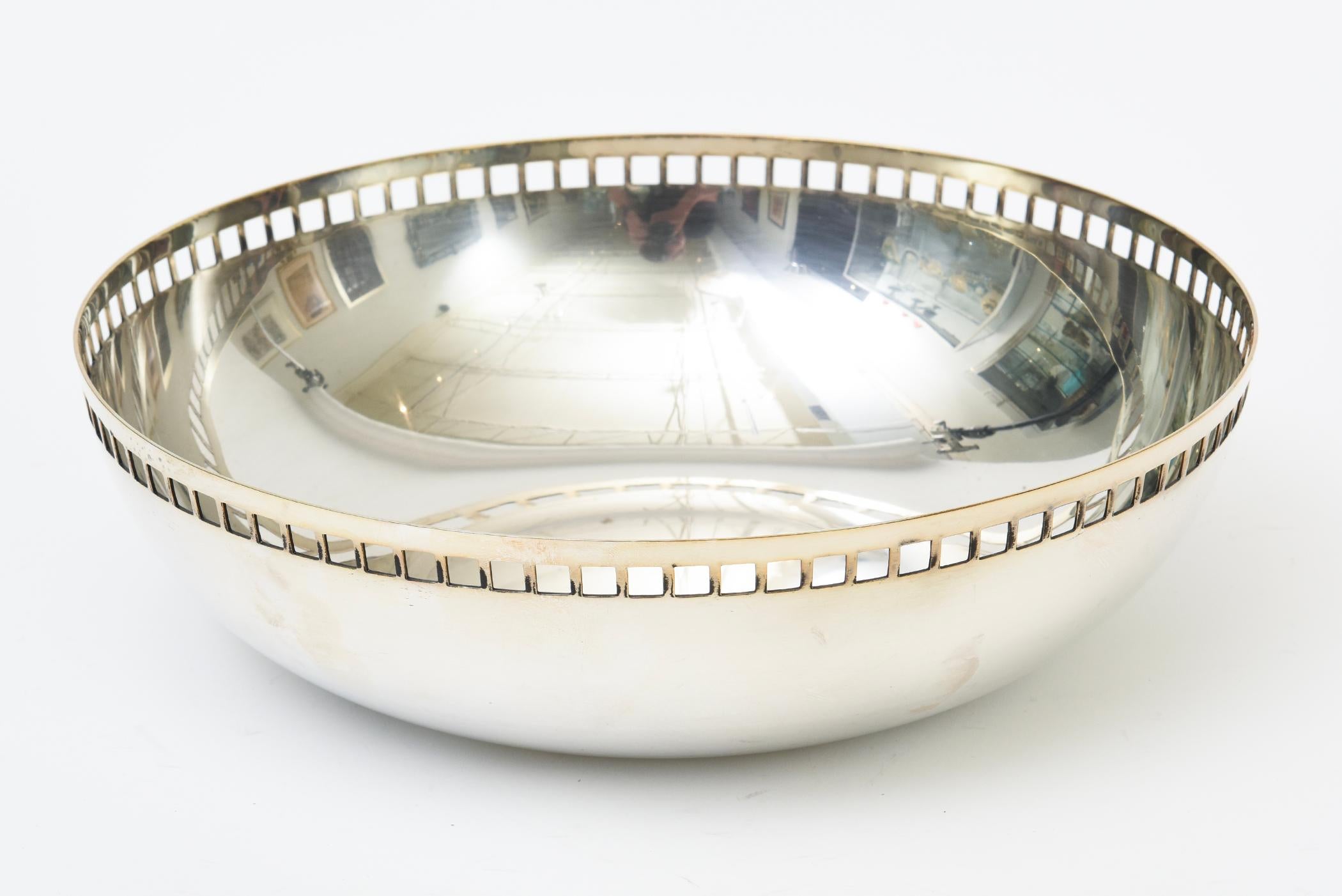 This iconic 1992 silver plate skyscraper bowl was designed by Richard Meier for Swid Powell. Made In Italy. It is an iconic design by an iconic architect. It was produced in 2 sizes this being the larger one of 10 inch diameter and 3