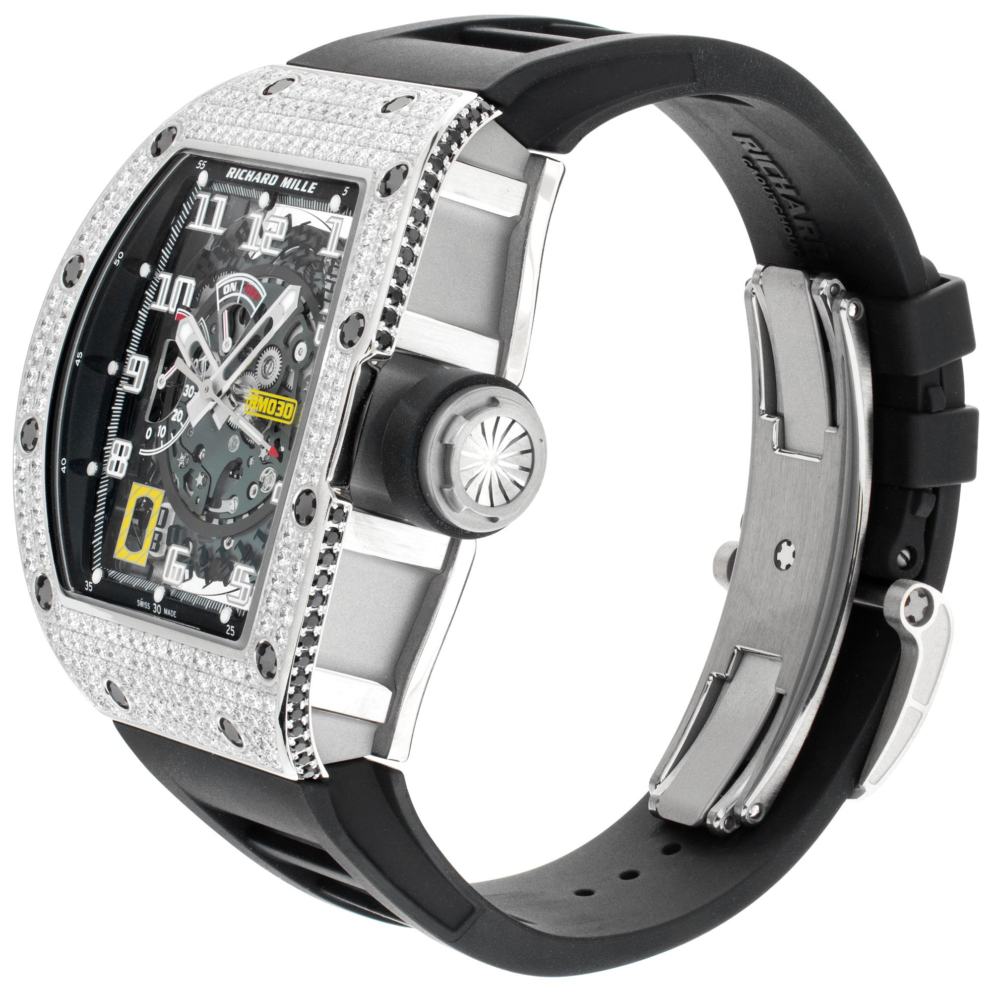 Richard Mille RM30 with skeleton dial in 18k white gold & titanium with factory original full pave diamond case on a rubber strap with titanium deployant buckle. Automatic movement under-glass with date, power reserve, and patented declutchable