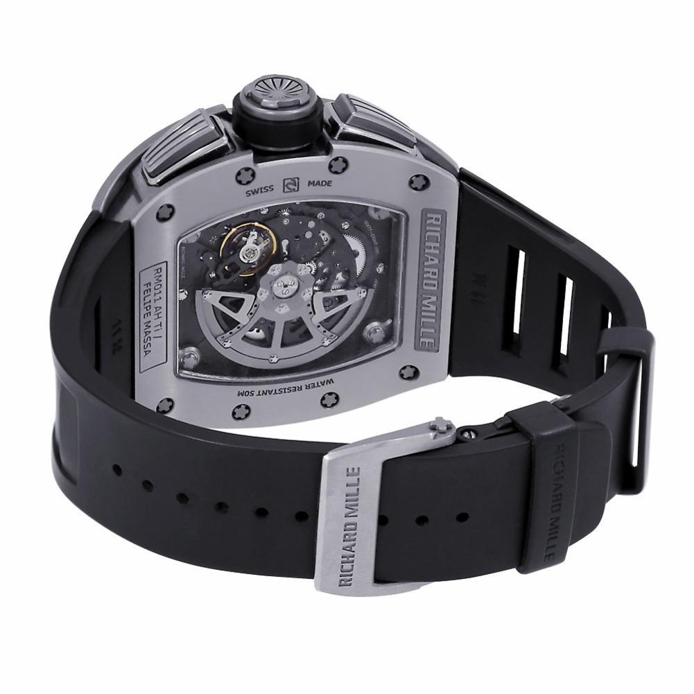 Richard Mille RM 011 Reference #:RM011. This is the magnificent Richard Mille Felipe Massa Flyback Chronograph Watch in White Gold. The alluring Tonneau shape watch measures 50 mm by 40 mm. Sapphire crystals on the front and back reveal the Richard