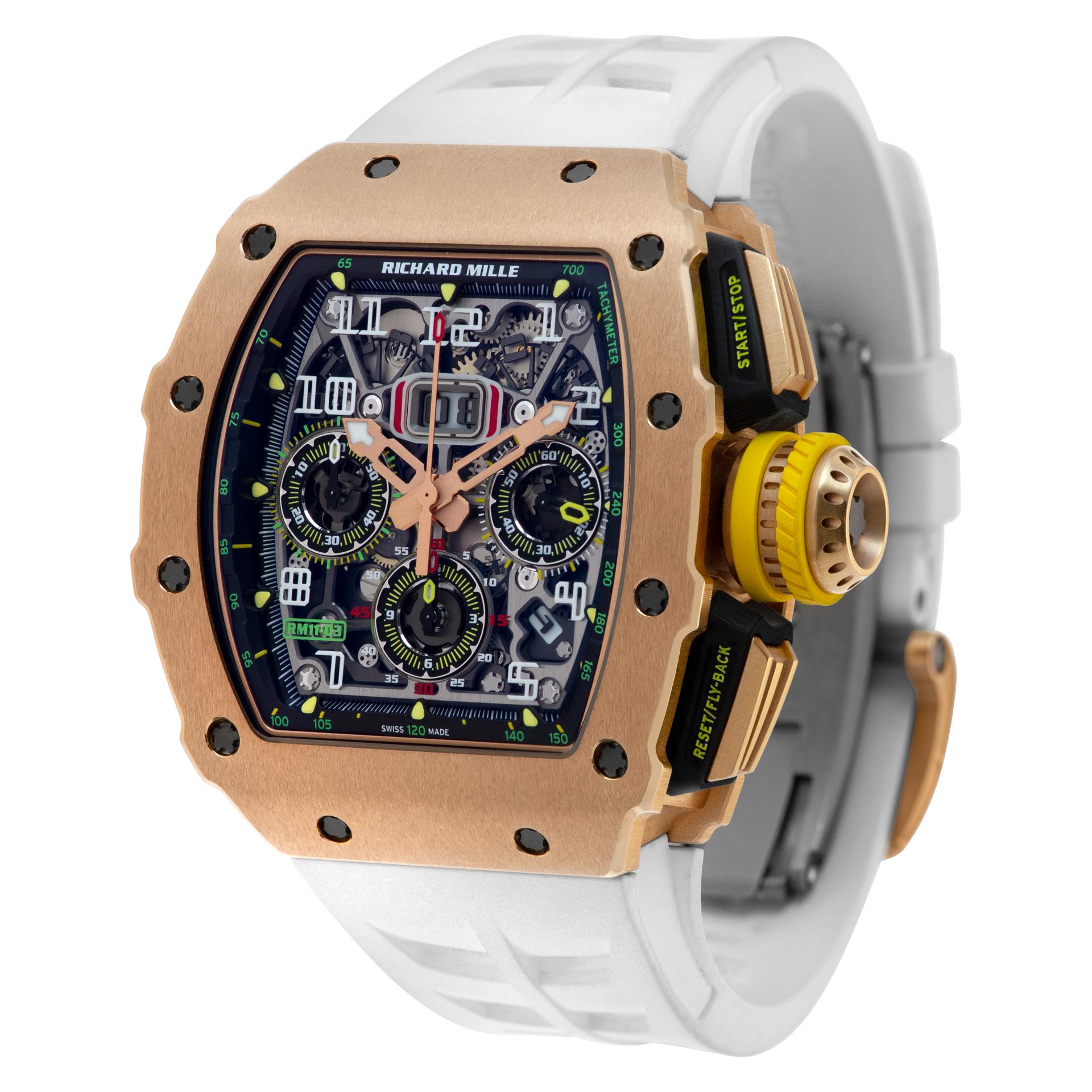 This ICONIC Richard Mille is uber collectible in brushed 18k rose gold with skeleton dial on a white rubber band. Auto w/ date, month and chronograph. 45 mm case size. With box and papers, warranty card and certificate, sealed, never opened. Ref