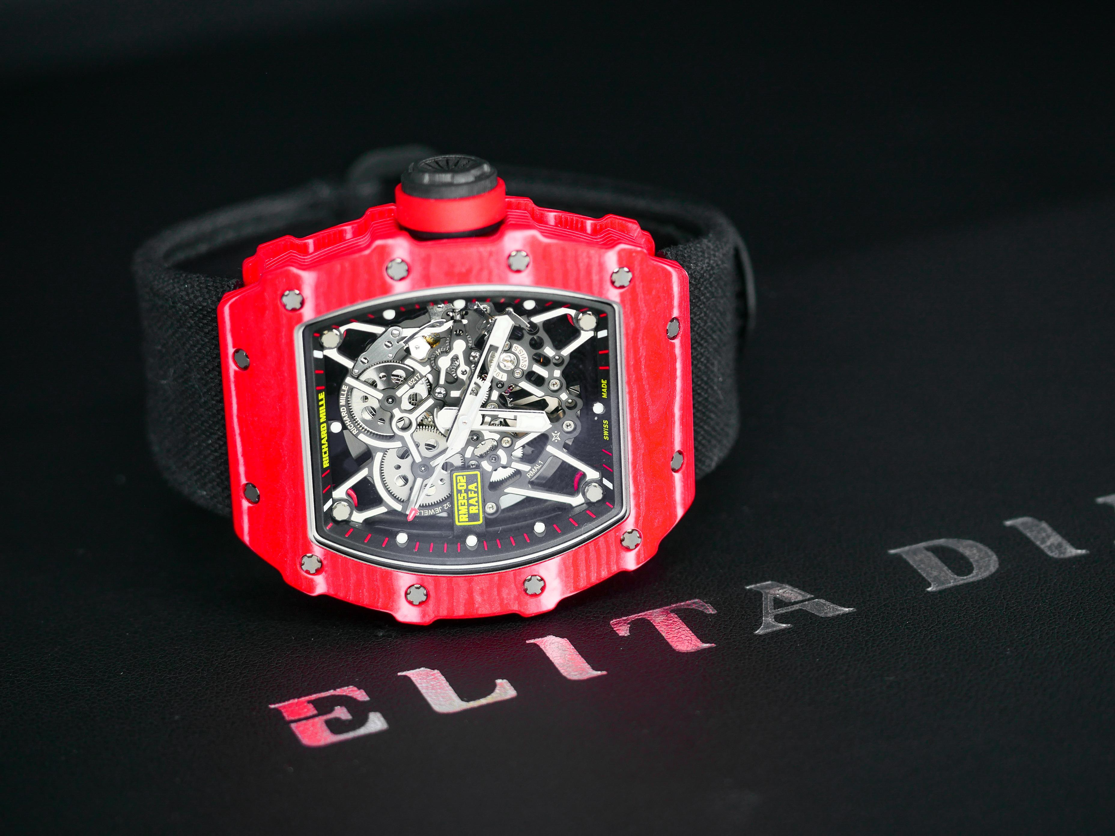 Richard Mille created this exotic watch for tennis superstar Rafael Nadal in red Quartz-TPT,  an exclusive material made only for Richard Mille. 

The case measures 49.94 mm at the case center and 44.5 mm where the strap connects. The scratch and