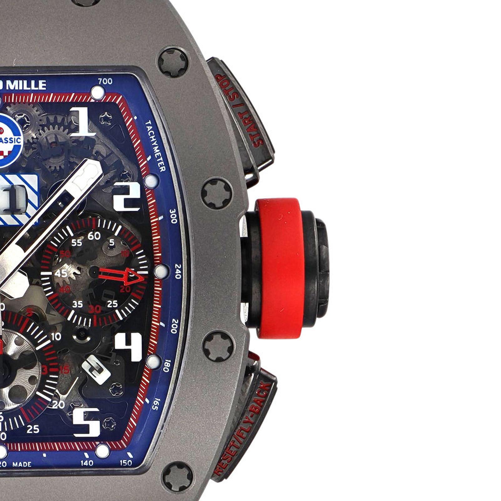 (32863)
This pre-owned Richard Mille Felipe Massa RM 011 is a beautiful men's timepiece that is powered by an automatic movement which is cased in a titanium case. It has a tonneau shape face, chronograph, date, small seconds subdial, tachymeter