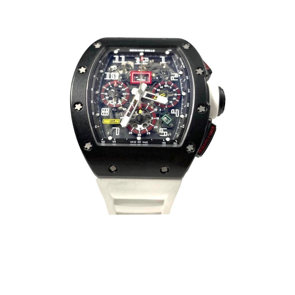 Brand: Richard Mille

Model Number: RM11 Felipe Massa

Movement: Automatic

Case Material: Black Carbon

Case Size: 50mm

Bezel: Black Carbon

Dial: Transparent 

Hour Markers: Luminescent

Bracelet Material: Rubber

Functions: Date, Chronograph,