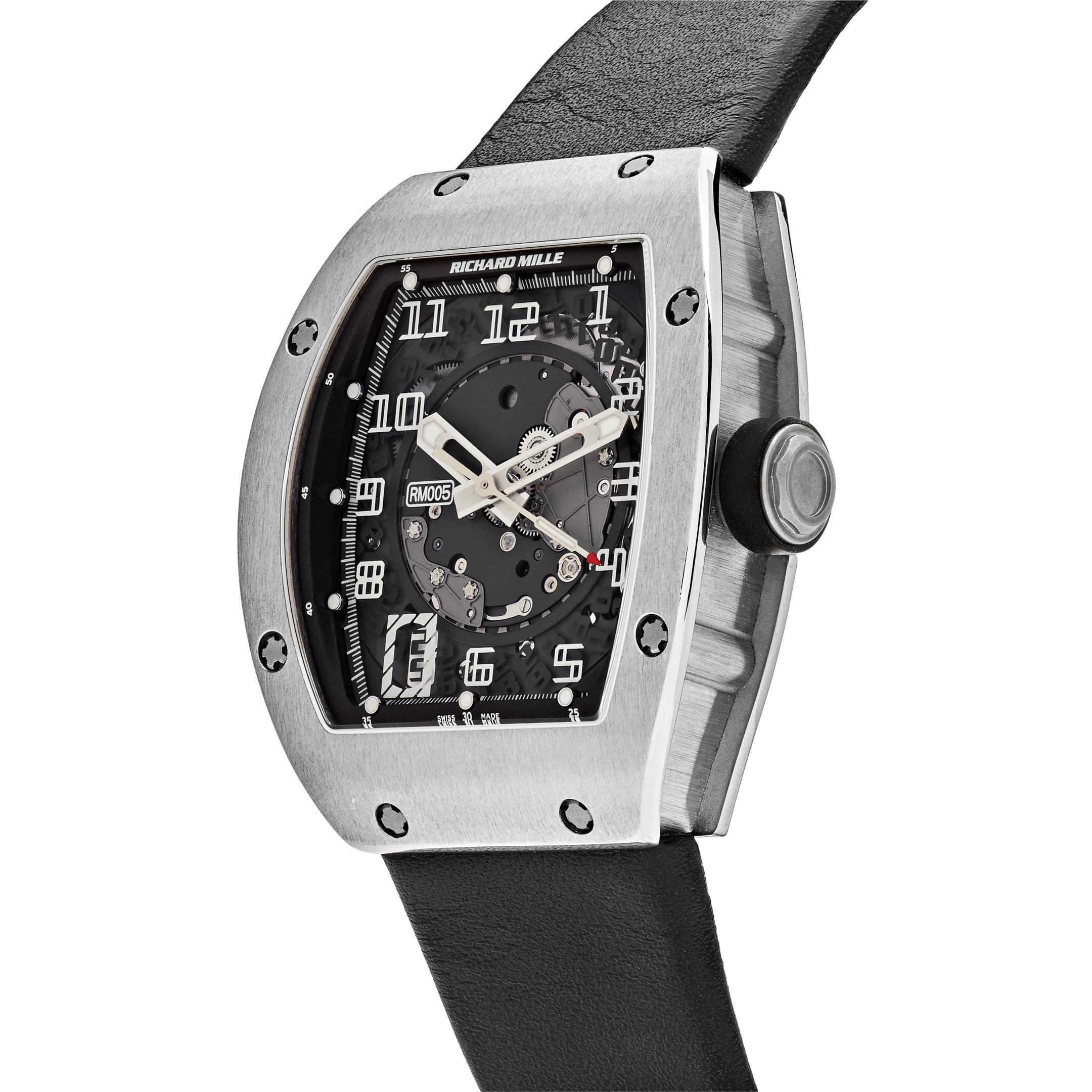 First introduced to the world in 2004, Richard Mille presented the very first RM005 with a semi-instantaneous date change. The watch features a 37.8mm white gold case surrounding a skeleton dial on a black rubber strap with a titanium buckle. It