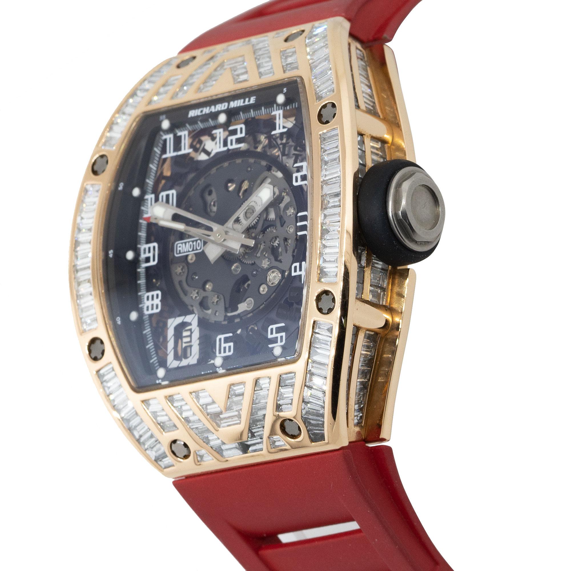 Brand: Richard Mille
MPN: RM010
Model: RM010
Case Material: 18k Rose Gold
Case Diameter: 48mm
Crystal: Sapphire Crystal
Bezel: 18k Rose Gold with aftermarket Diamonds
Dial: Skeleton dial
Bracelet: Red two piece strap
Size: Adjustable
Movement: