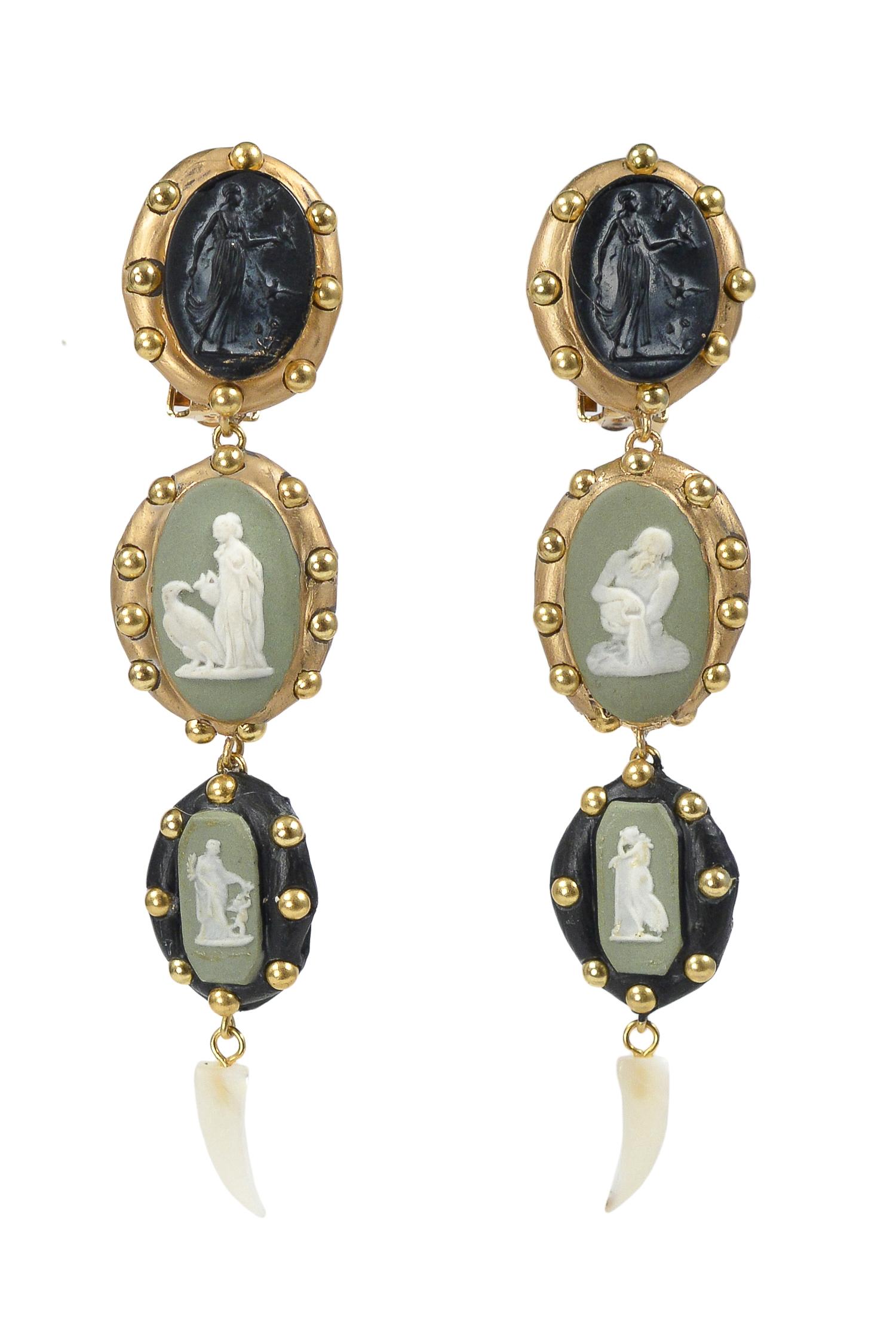Handmade and one-of-a-kind Richard Minadeo drop clip earrings that feature green and white Wedgwood cameos set in resin with studs. 

We are pleased to announce Resurrected: Richard Minadeo and the art of Memento Mori: 1980’s and Today. Famous in