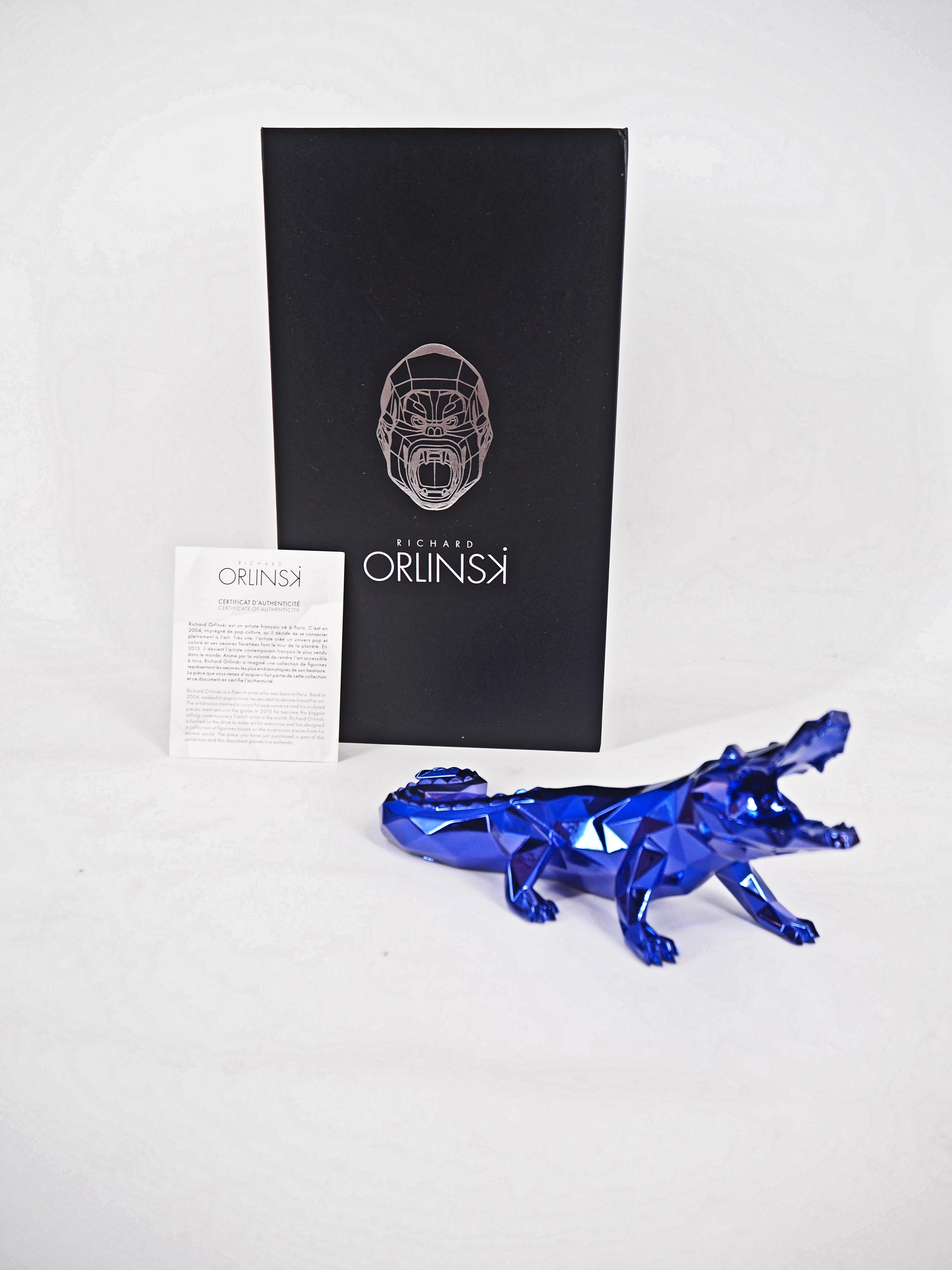 Richard ORLINSKI
Esprit croco (édition violette)

Sculpture en résine
Violet
Environ 24 x10 x 8 cm (c. 9.5 x 4 x 3 in)
Présenté dans sa boîte d'origine avec certificat

Excellent état