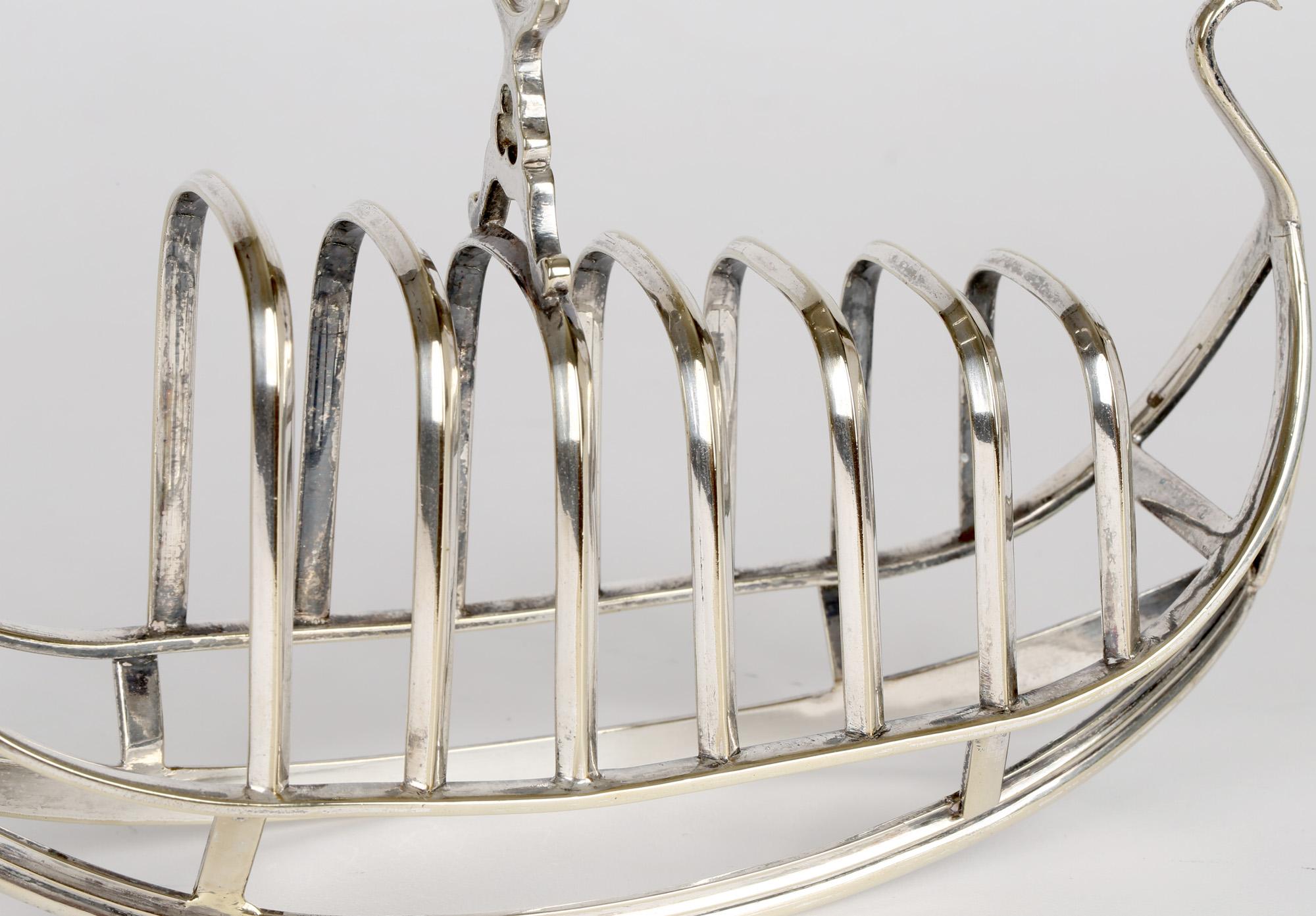 A scarce and unusual antique English Sheffield silver plated toast rack modeled as a Venetian gondola made by Richard Richardson and dating from the 19th century. The toast rack is well made sitting on a rounded hull shaped open work frame with a