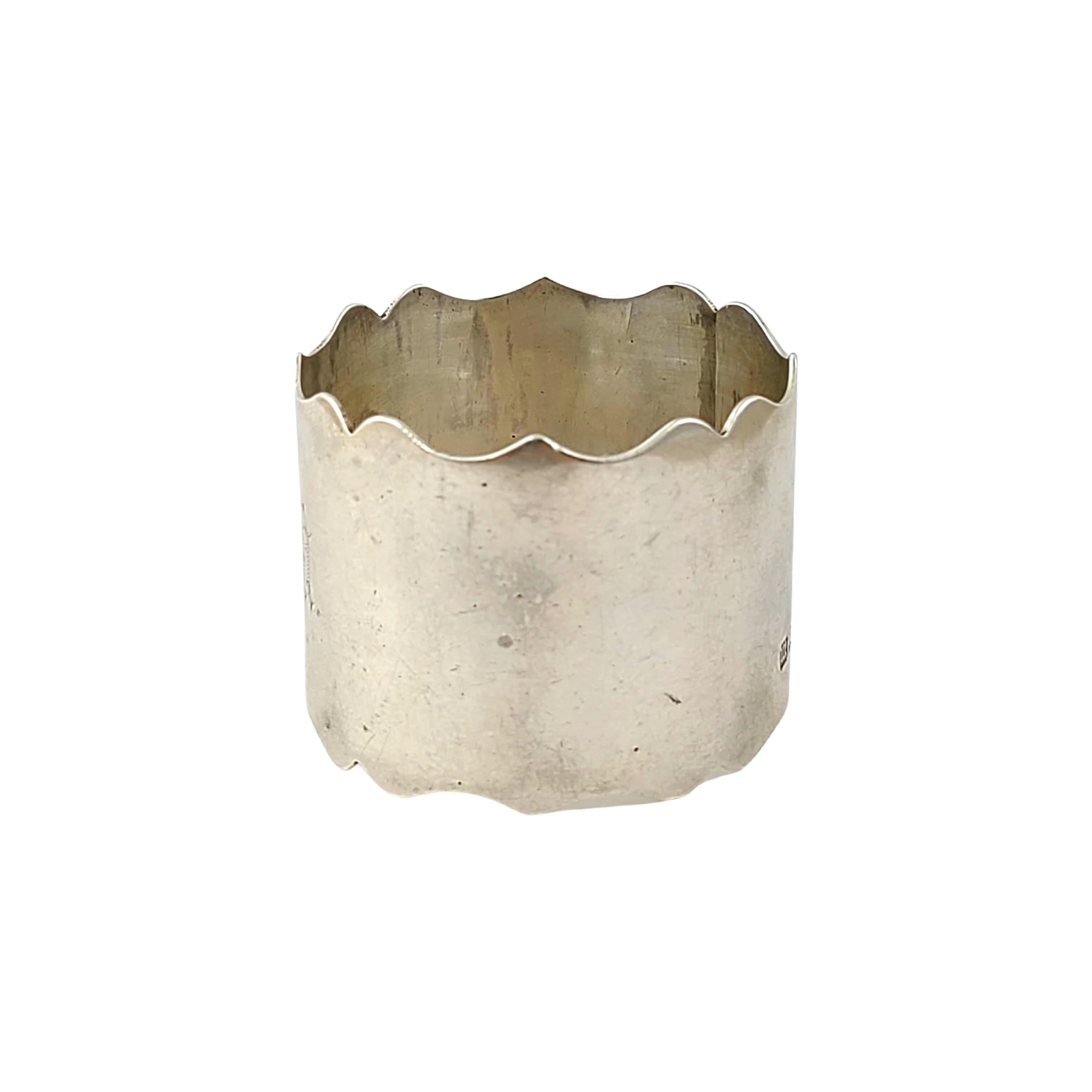 Sterling silver napkin ring by Richard Richardson of Sheffield, circa 1904.

Monogram appears to be EGM

Scalloped edges with a polished finish. 

Measures 1 3/8