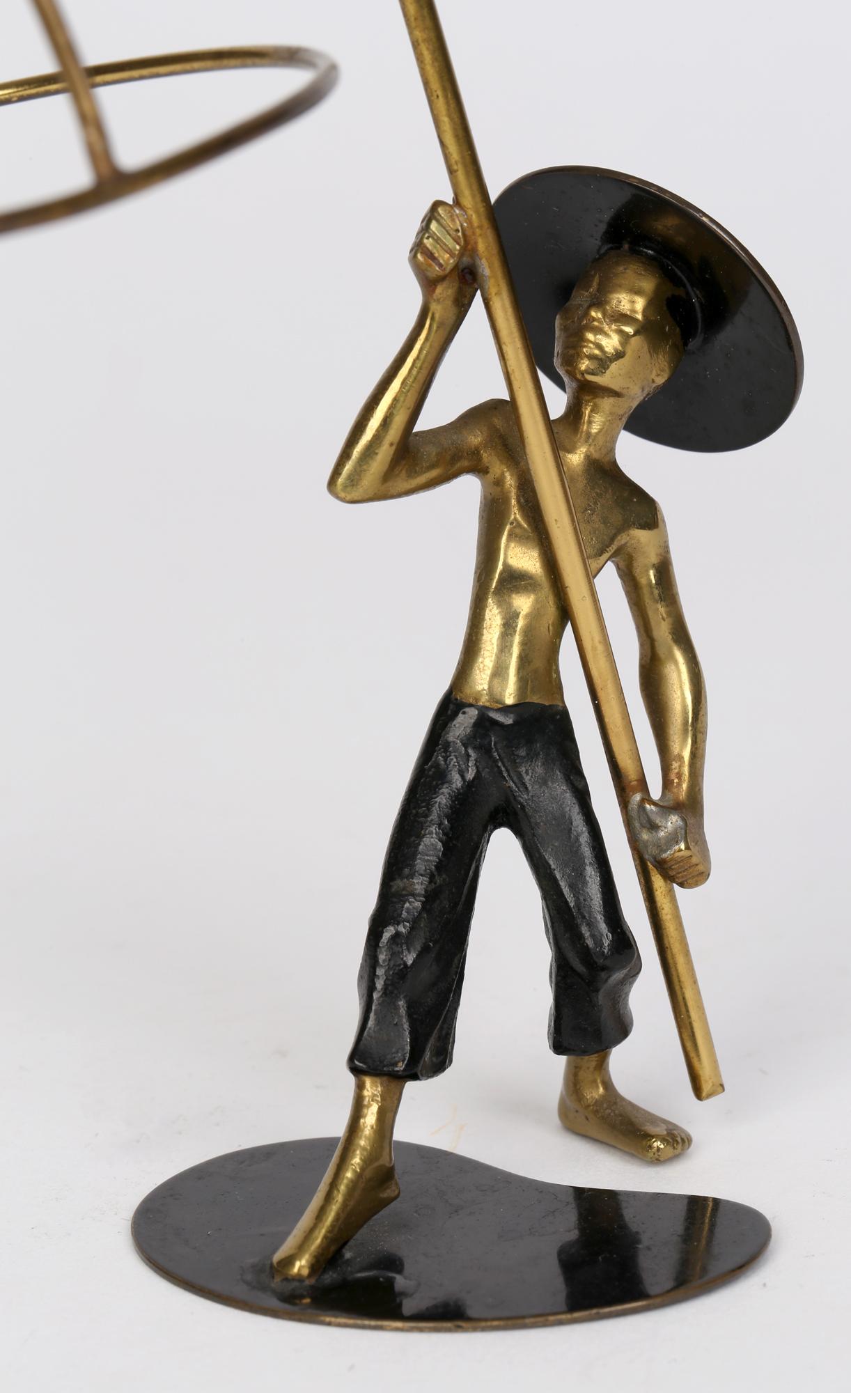 A very stylish Austrian Art Deco bronze Asian bird catcher figure attributed to Richard Rohac (Austrian, 1906-1956) made in Vienna in the early 1930’s. Rohac spent his early years as an apprentice with Werkstätte Hagenauer Wien and continued to work