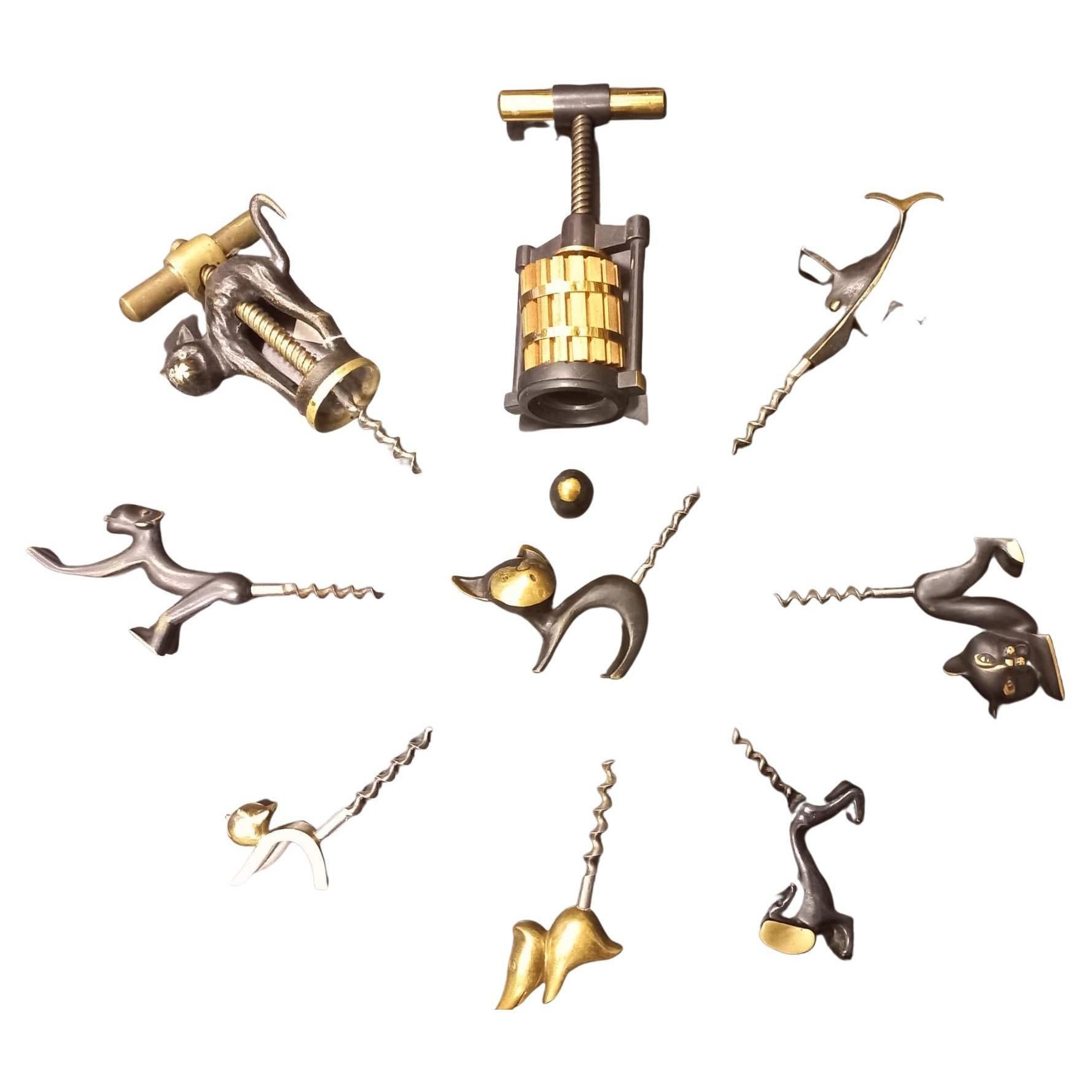 Numbering is in clockwise order in the series 

Richard Rohac:
1st corkscrew in the shape of a press 460€.
2nd Viennese bronze swordfish 350€
3rd Viennese bronze cat 490€
4th Viennese bronze basset hound 380€
5th vienna bronze mouse 460€
6.