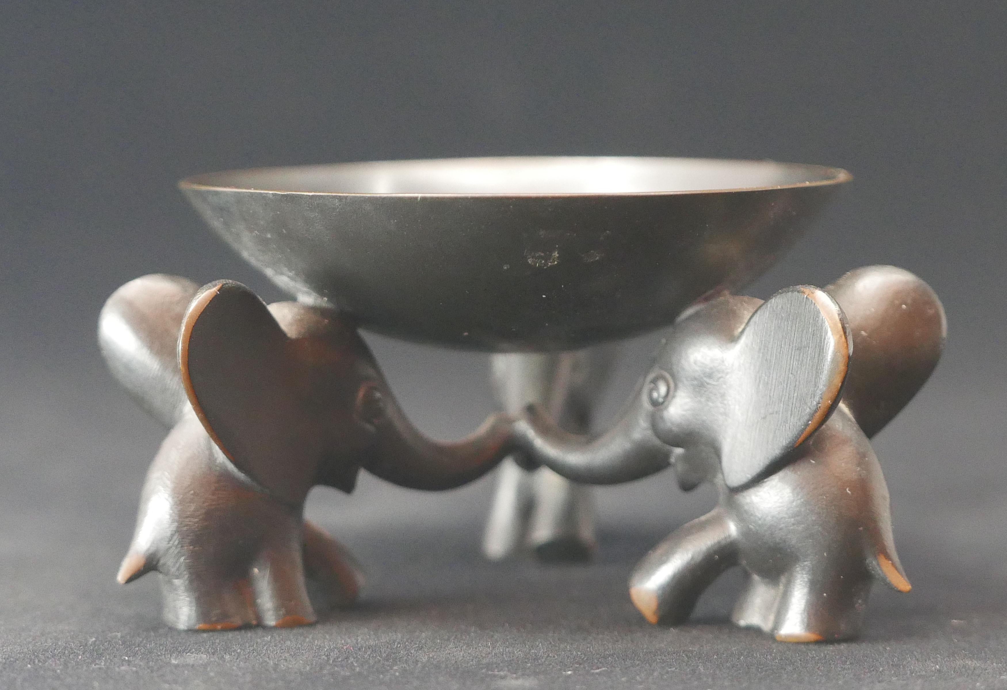 Stunning small pedestal bowl with three elephants supporting the bowl, made from blackened brass. Designed and executed by Richard Rohac in Austria in the 1950s, who worked also for WHW Hagenauer Vienna. Probably originally designed as an ashtray