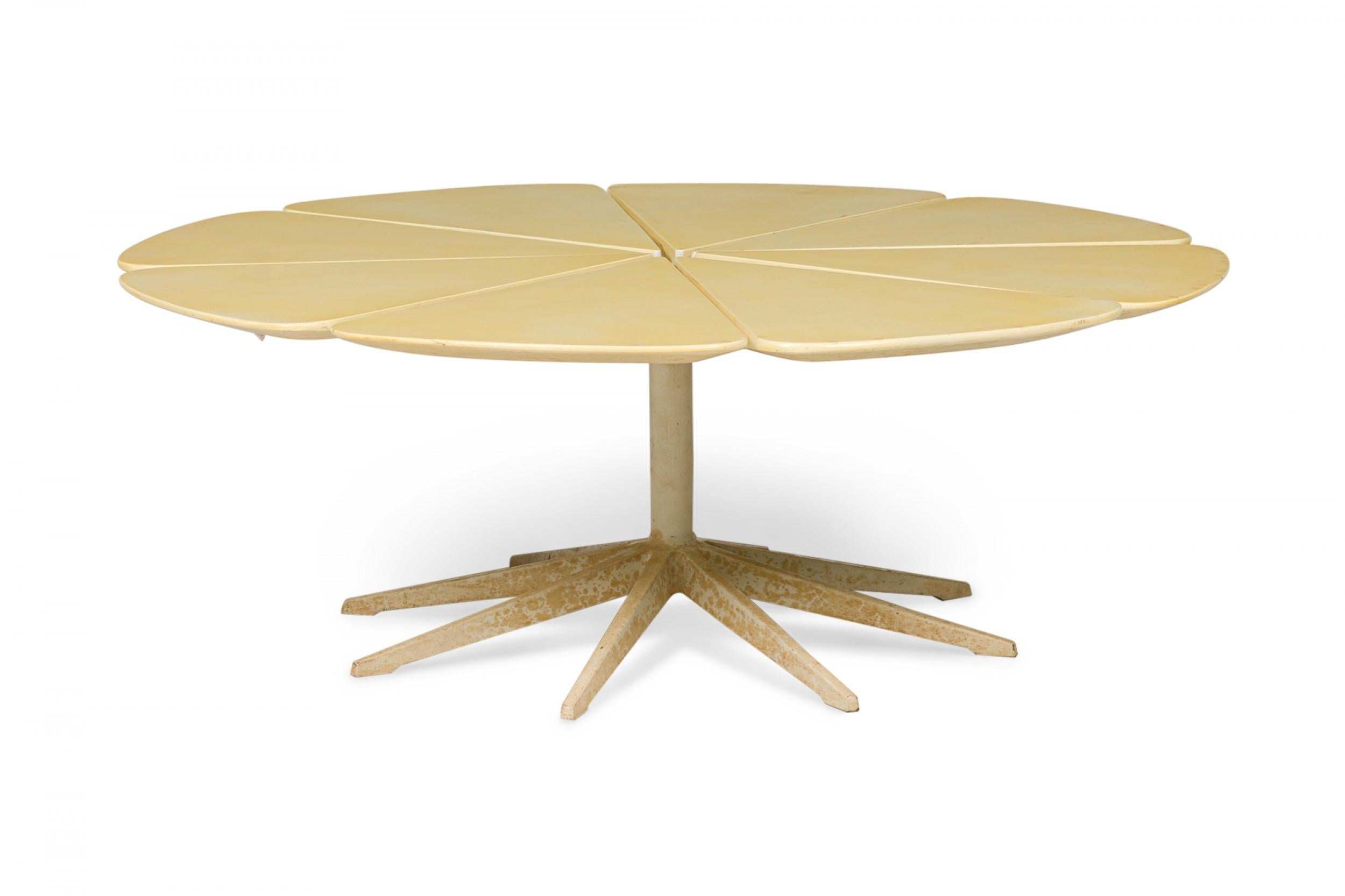 American mid-century 'petal' form coffee / cocktail table made of redwood and finished with beige lacquer, resting on a pedestal base. (Richard Schultz for Knoll International).