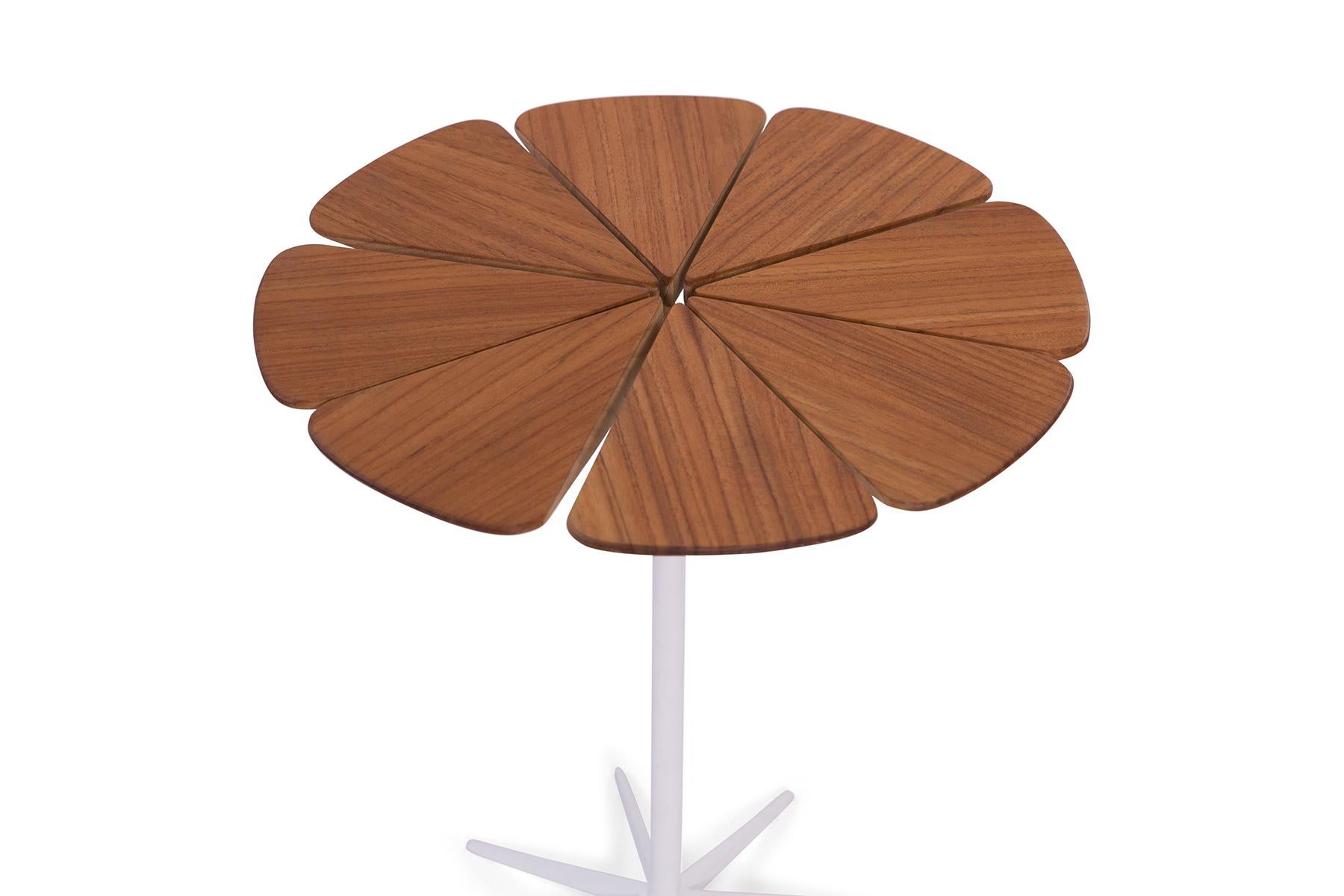 This iconic 1970s Knoll petal side table by Richard Shultz is the perfect way to add some midcentury whimsy to any room. The white aluminum base is powder coated and the eponymous petal top is teak.