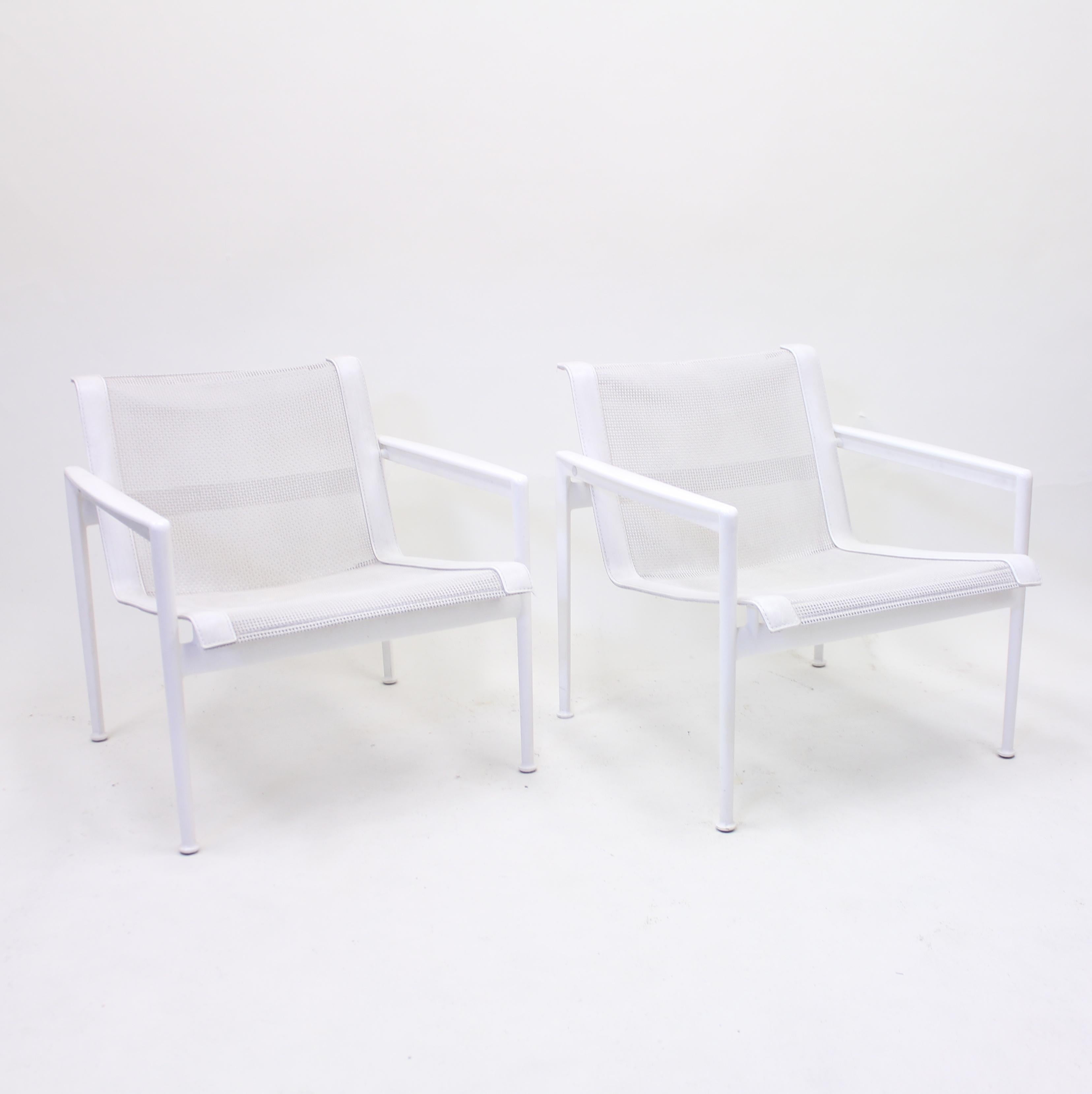 Pair of low outdoor/indoor armchairs, in white lacquered steel with leather and net seat and back, designed på Richard Schultz in 1966 and produced by B&B Italia. They are a part of the Schultz collection which contains several models in the same