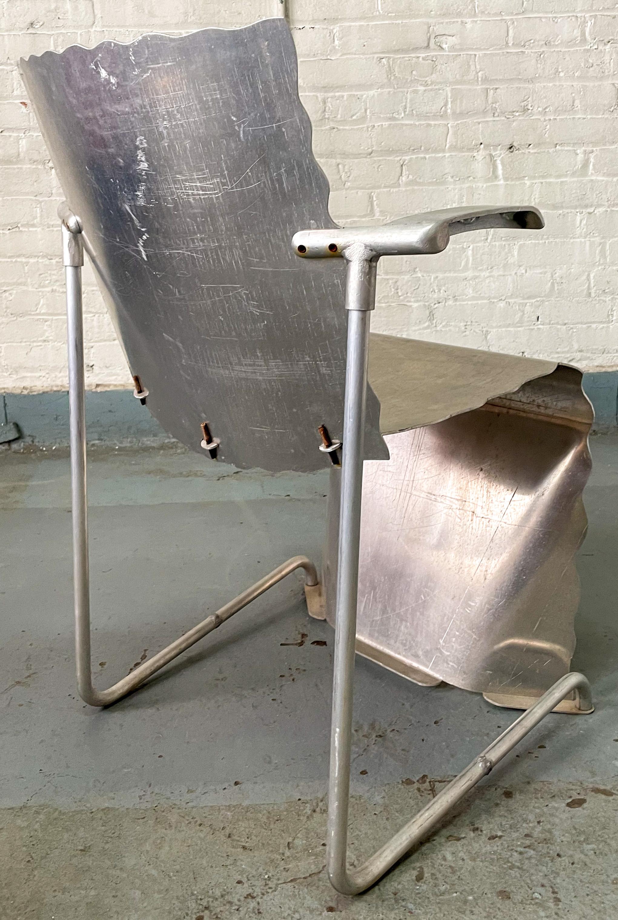 Prototype stacking chair hand-built of aluminum by furniture designer and artist Richard Schultz as a full-size 3-D model exploring the ergonomic and sculptural qualities of a design in which the seat is formed as a continuous ribbon of sheet metal,