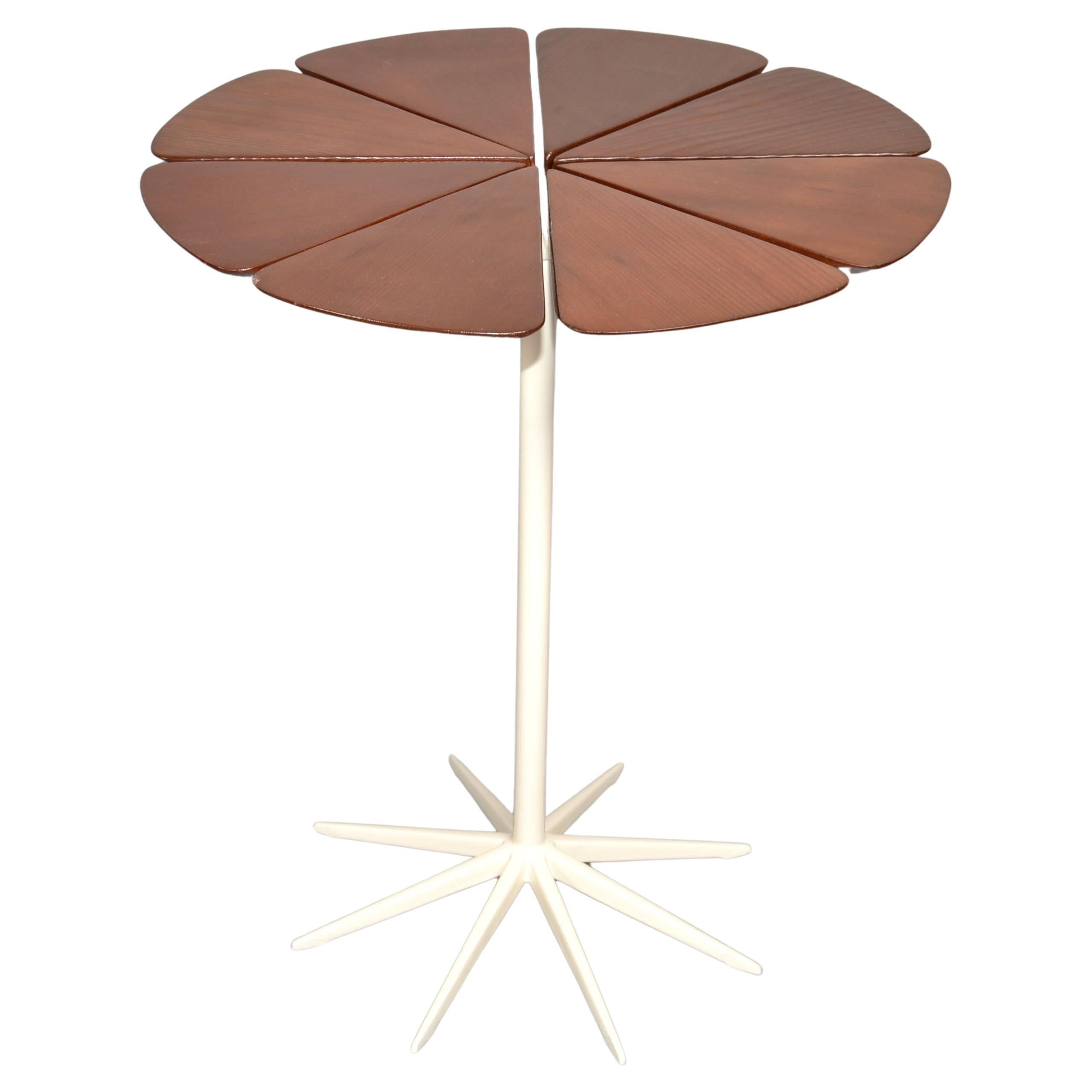 Mid-Century Modern 1960 designed Petal End Table by Richard Schultz and made by Knoll Associates, America.
This Side Table is made out of an Aluminum stem in a white enamel finish. The Top is dark stained grained Teak Wood in a beautiful shine.  