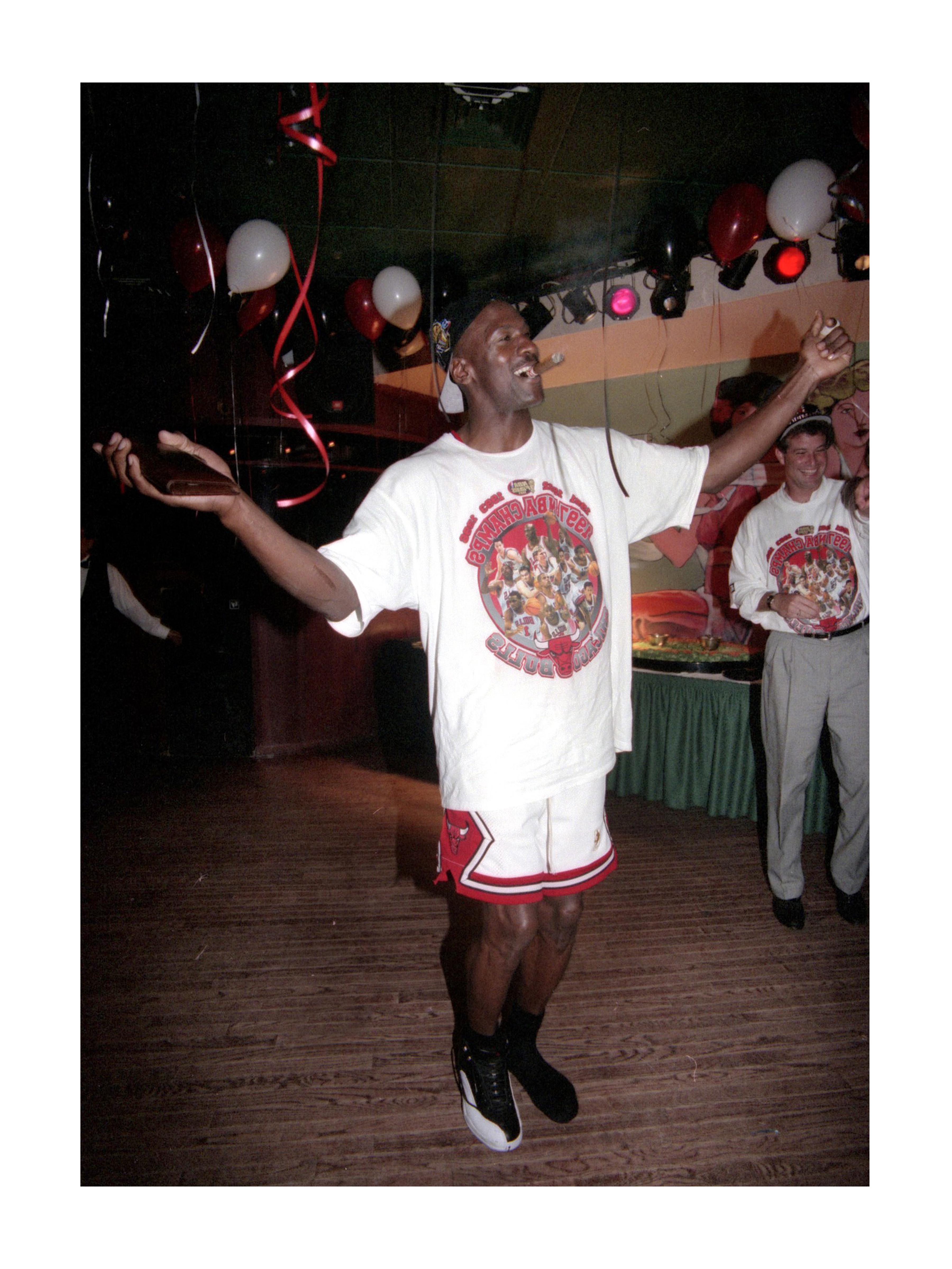 Richard Shay Color Photograph - Shoeless Michael Jordan Celebrating 5th Championship Win, 1997 - Color Photo