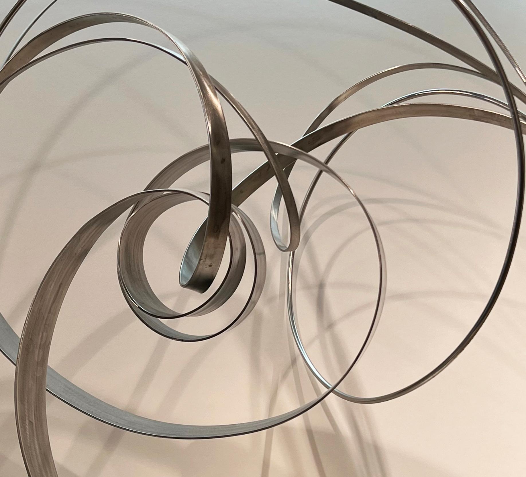 Regroup, large stainless steel and stone spiral abstract sculpture, 2021 - Sculpture by Richard Sturgeon