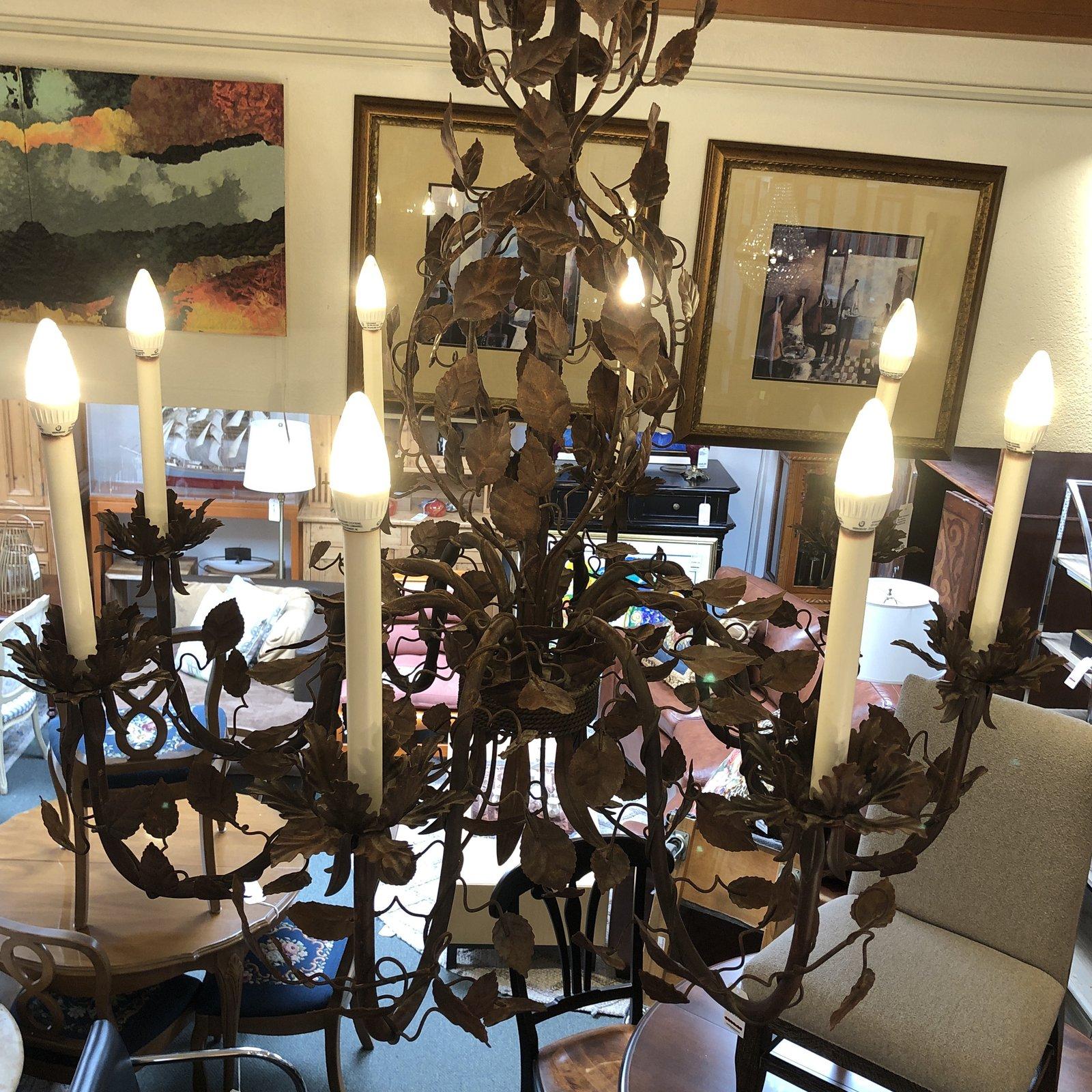 A Richard Taylor design style chandelier. Handcrafted from metal by skilled artisans, consist of eight lights. Inspired by the horticultural practices of training perennials plants by clipping the foliage and twigs of shrubs. Each leaf is hand