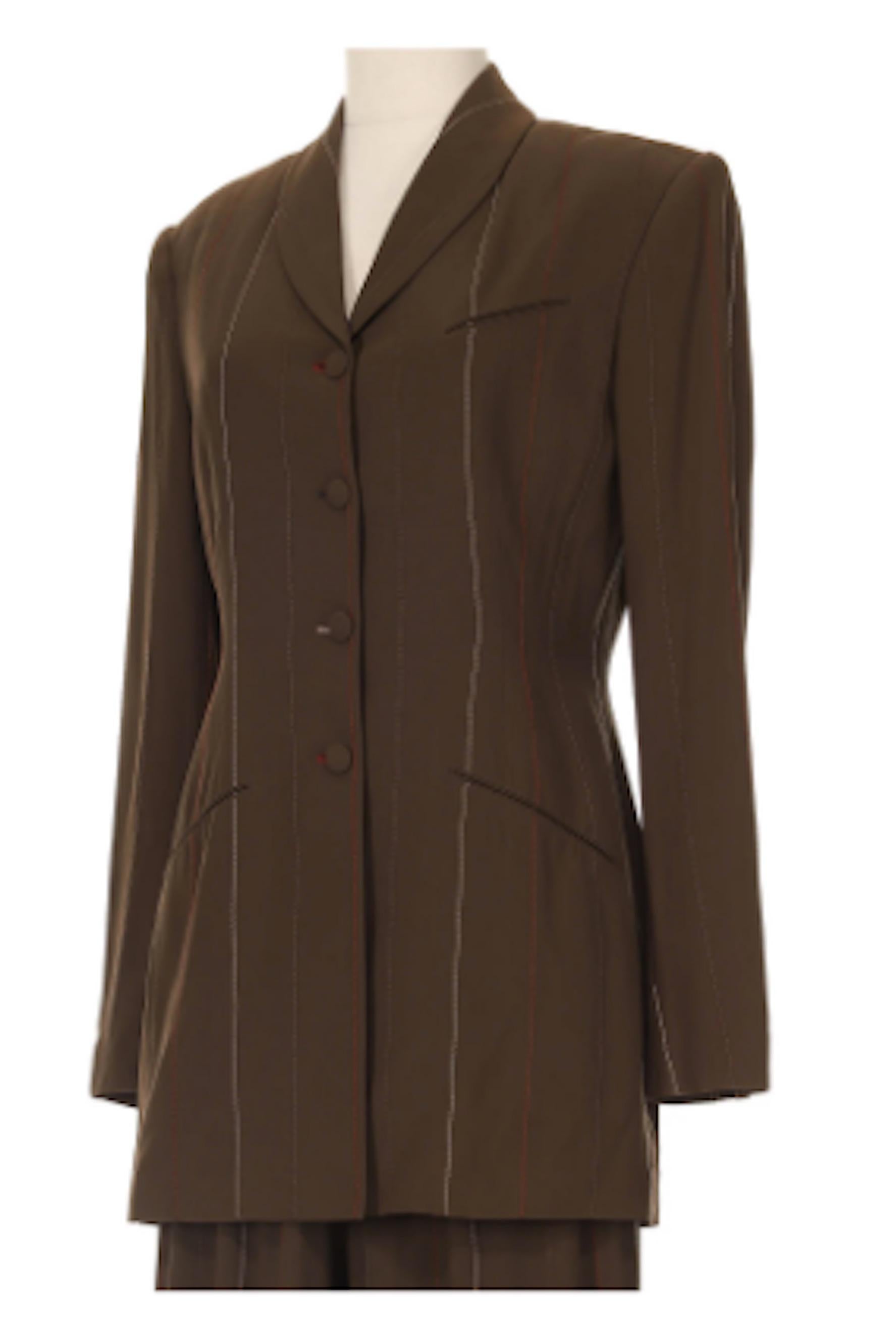 Richard Tyler Stitched Pinstripe Brown Pantsuit Circa 1990's.Oversized yet tailored blazer jacket with four front buttons and matching pants with front zipper closure. Embellished with red, brown and light brown pinstripe stitching.
- Estimated