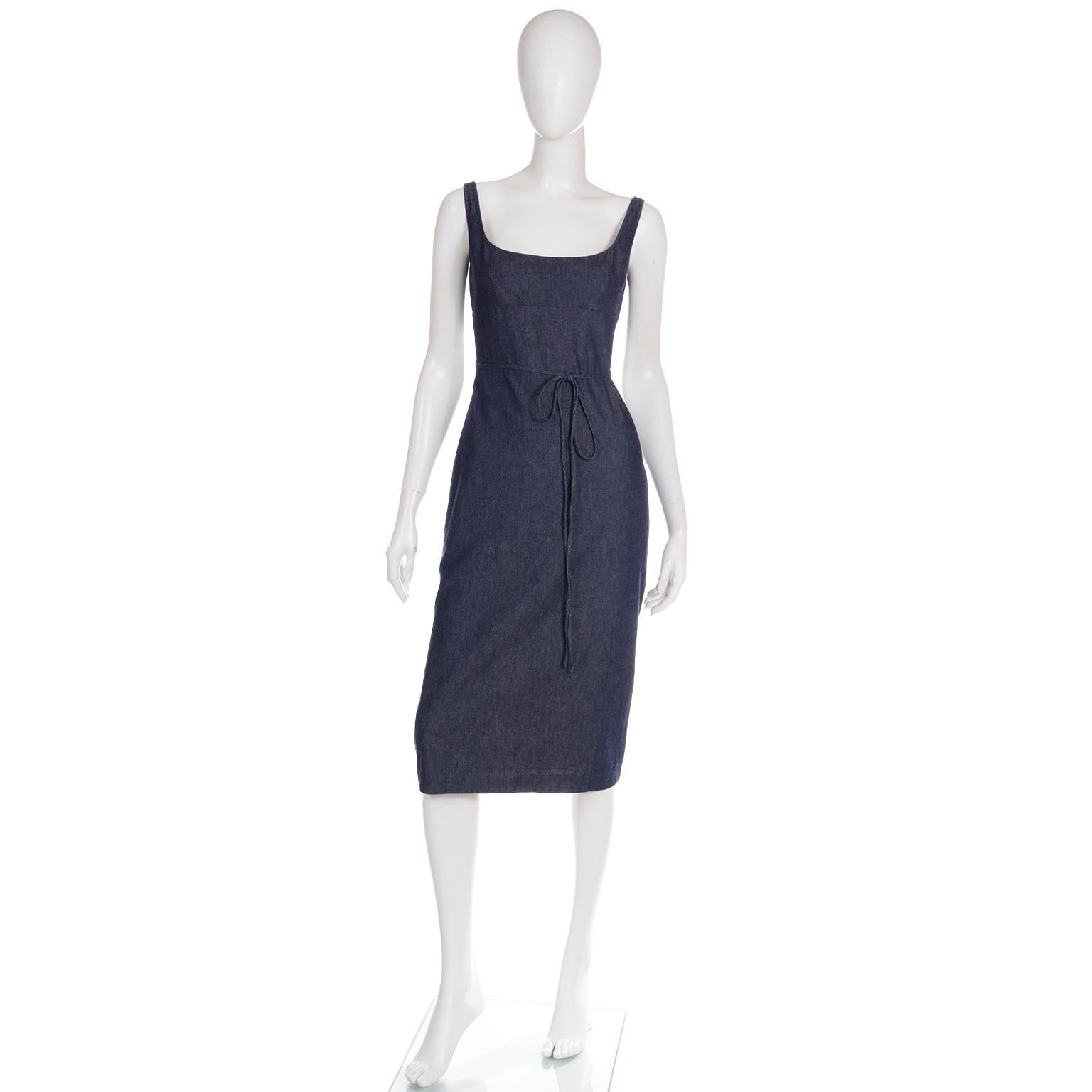 This is a great vintage early 2000's Richard Tyler Collection dark blue denim dress that 	wraps around and ties in the front. The dress has open areas in the back, making it much more interesting, a signature element in many Richard Tyler dresses.