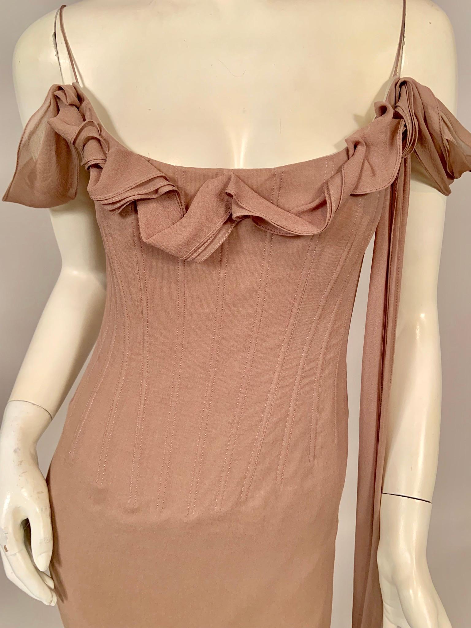 This is a wonderful design from Richard Tyler Couture. The dress has spaghetti straps, a twisted silk chiffon trim at the neckline which incorporates an off the shoulder sleeve treatment and chiffon streamers. The bodice is boned front and back, in