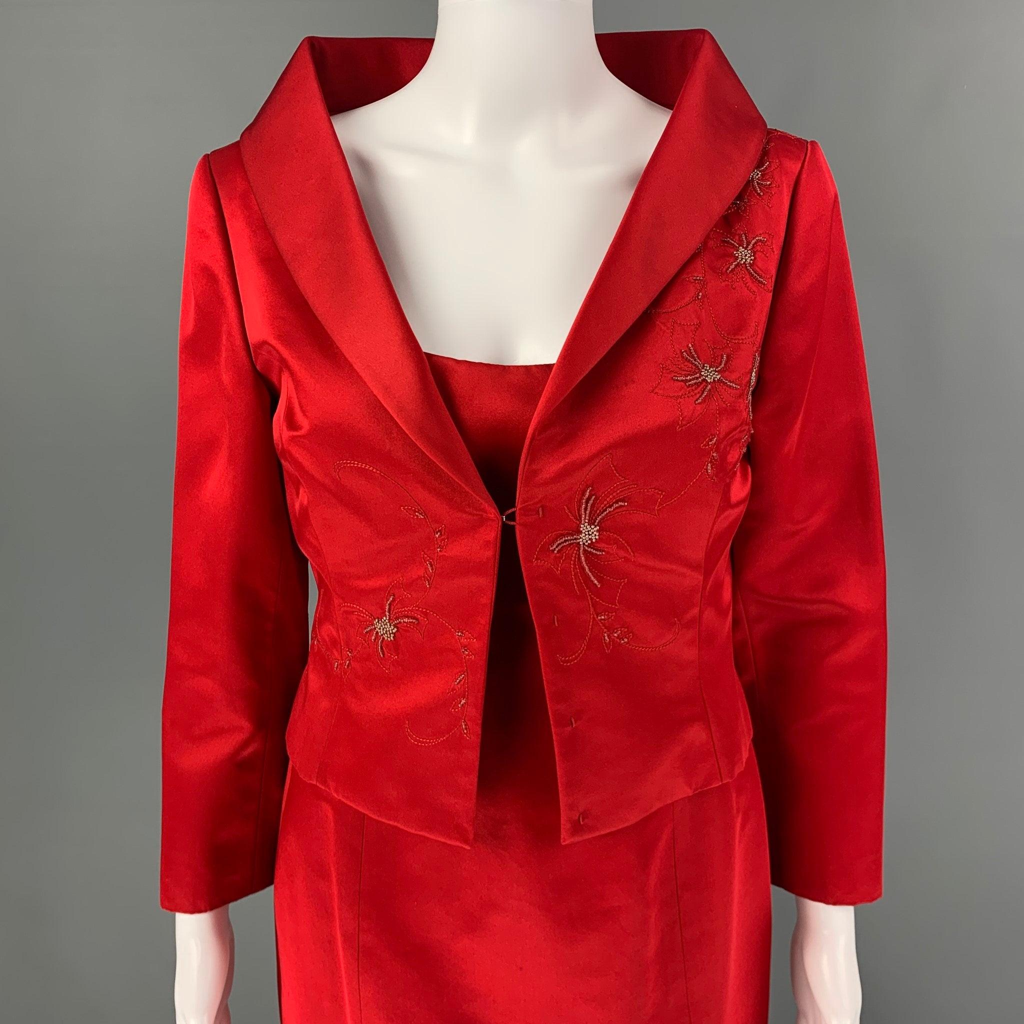 L'ensemble 2 pièces RICHARD TYLER Couture est présenté dans un tissu rouge de soie et de rayonne. Il comprend une robe de style aplati, des bretelles élastiques, une fermeture à glissière latérale et une veste à col châle ornée de