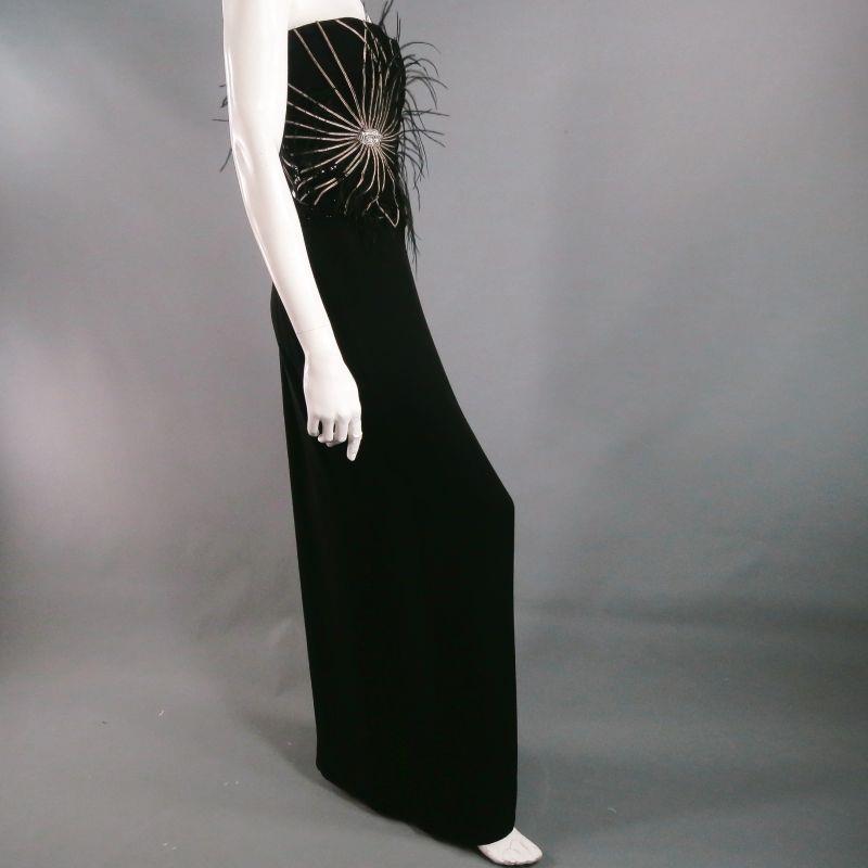 Sexy, stunning strapless dress by RICHARD TYLER. 
Full length in black jersey. 
Intricate detailing through bodice including beads, feathers and braided, metallic ribbon. 
Feathers take on their own whispy movement as you move. 
High slit at left.