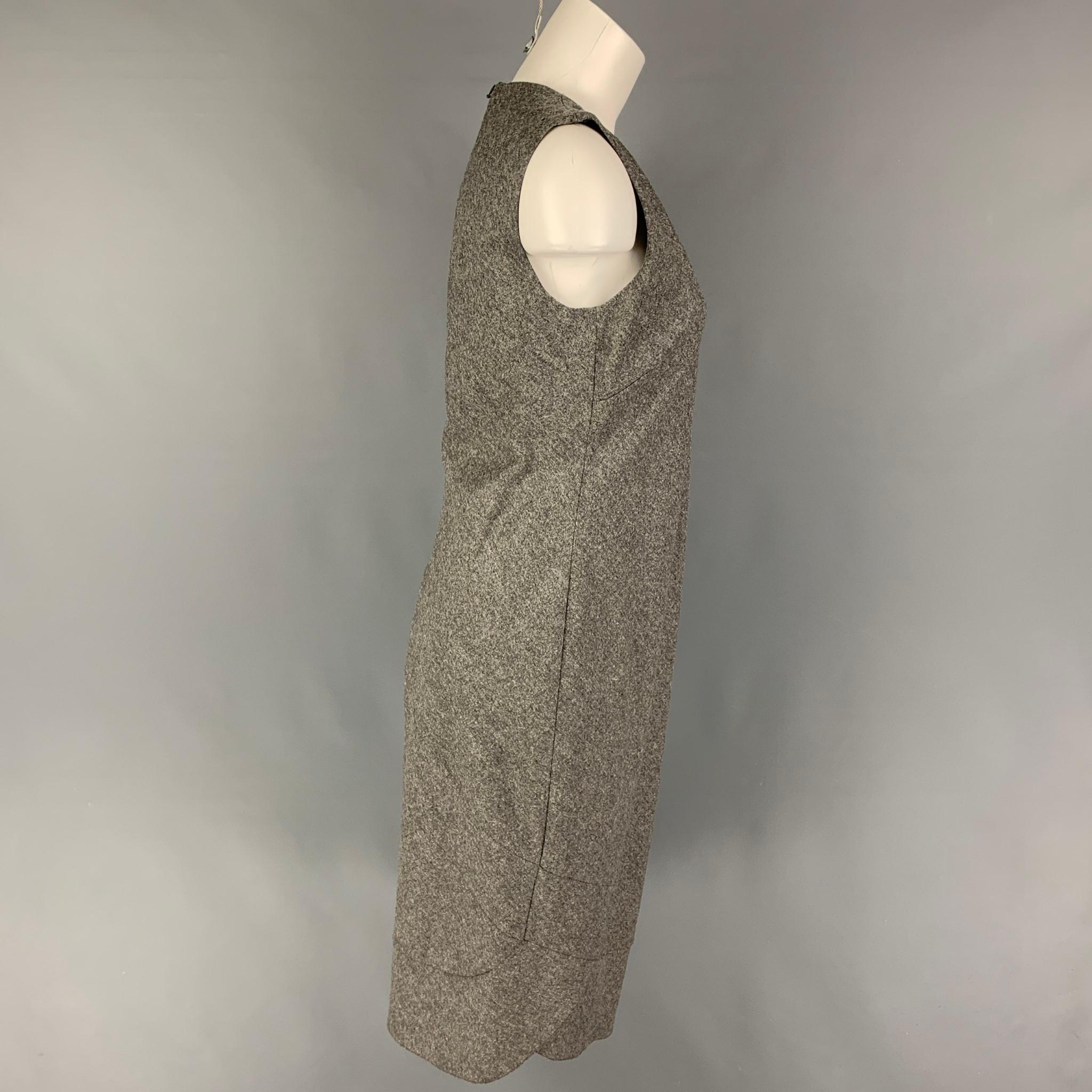 RICHARD TYLER dress comes in a grey virgin wool / cashmere featuring a v-neck, sleeveless, and a back zip up closure. 

Very Good Pre-Owned Condition.
Marked: 44

Measurements:

Shoulder: 14.5 in.
Bust: 34 in.
Waist: 30 in.
Hip: 36 in.
Length: 42.5