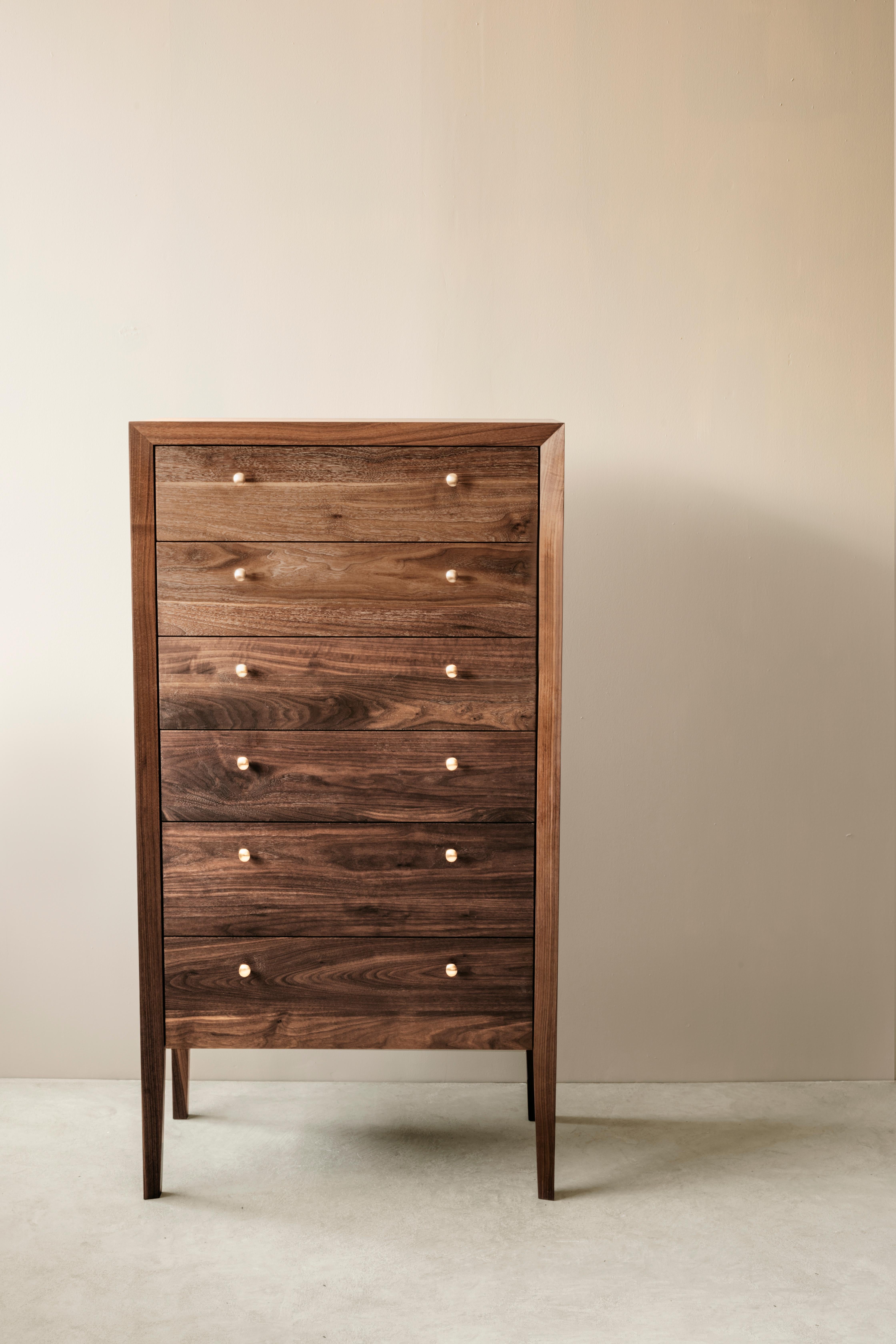 The chest of drawers was designed with meticulous attention to detail - carefully studied proportions, hand selected boards that highlight the beautiful movement and grain patterns in their hardwoods, dovetail joinery and slides. The Richard Watson
