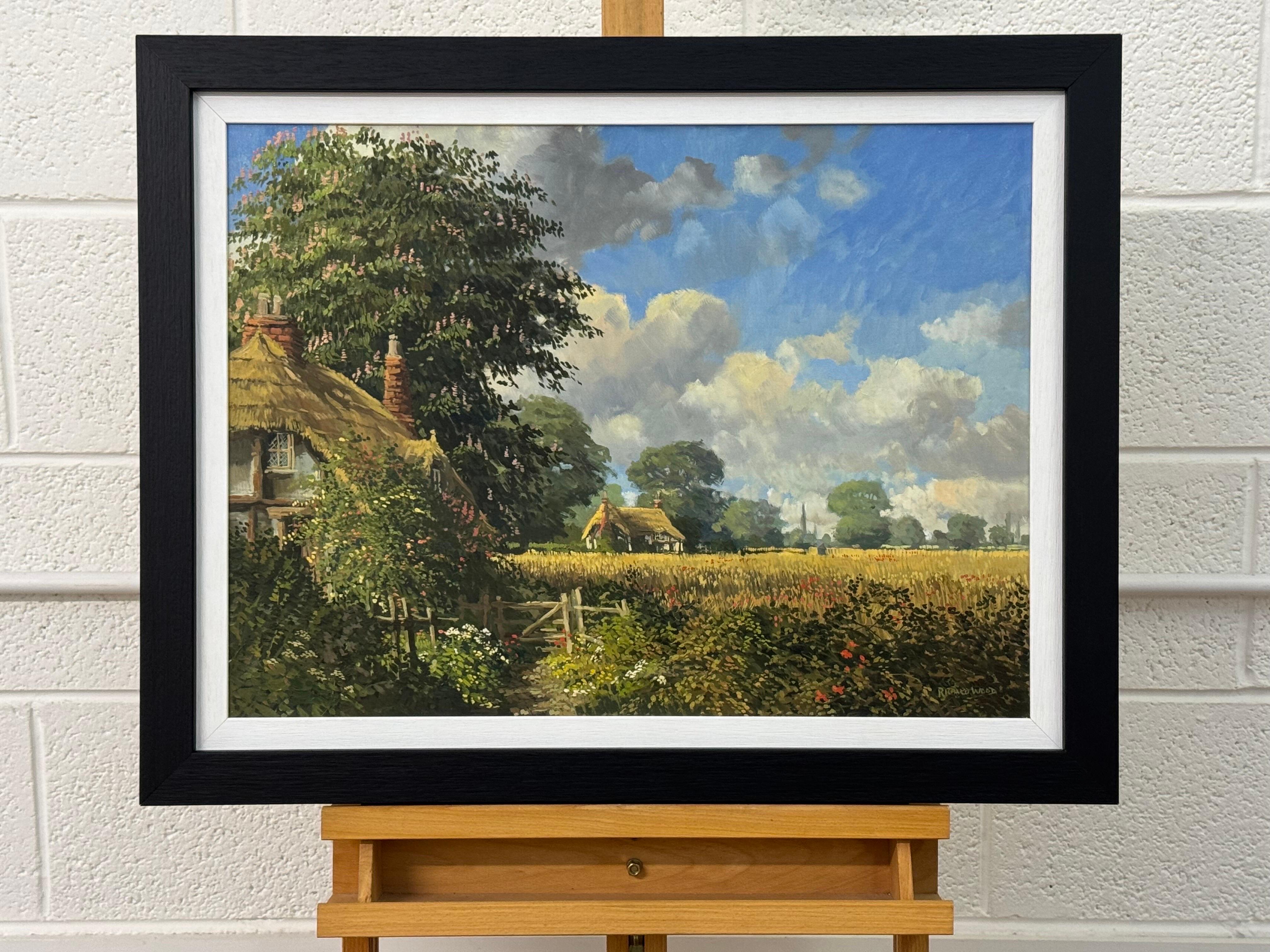 Cottages au toit de chaume avec fleurs sauvages et Church's dans la campagne anglaise - École anglaise Painting par Richard Wood