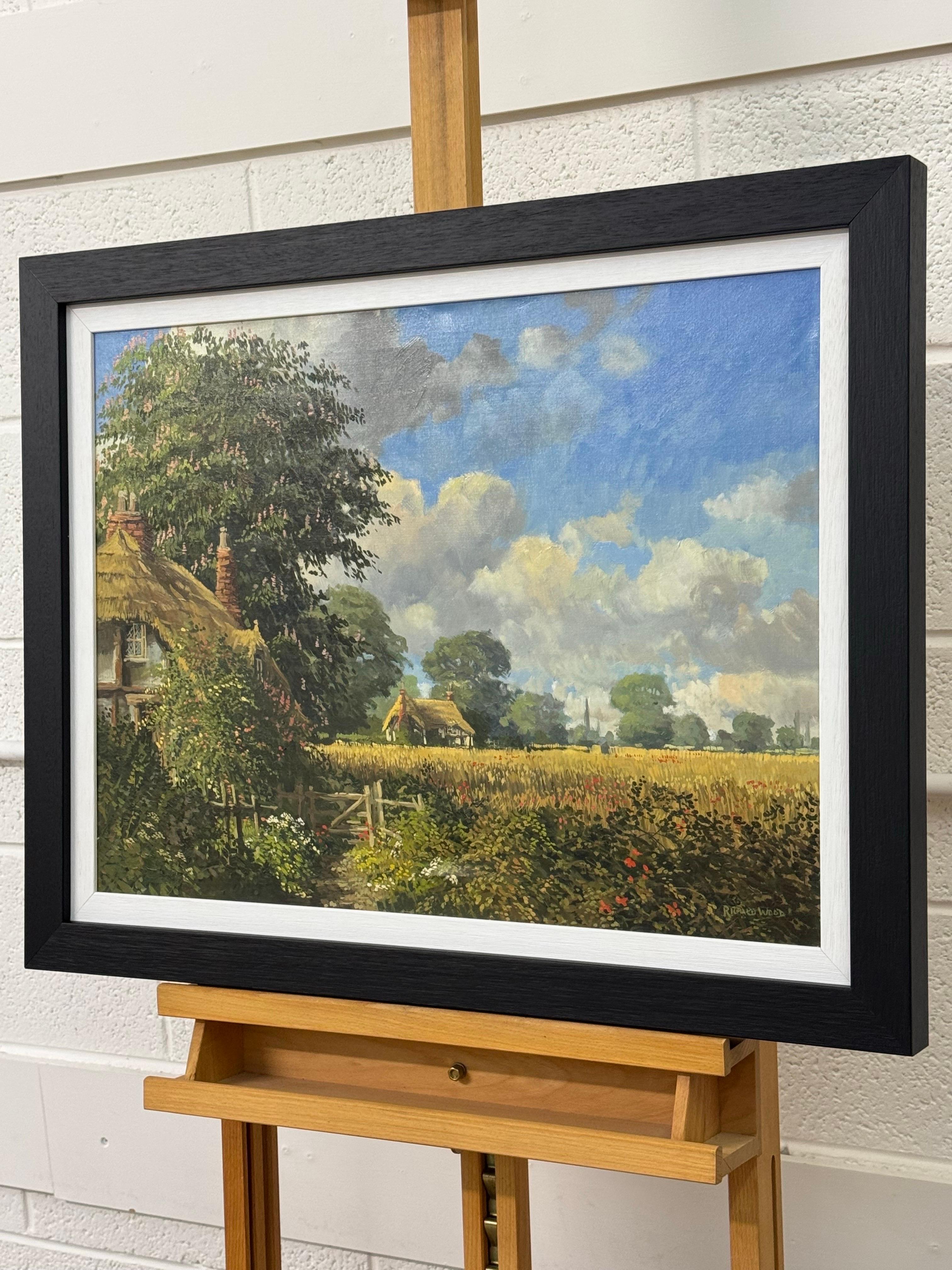 Cottages au toit de chaume avec fleurs sauvages et Church's dans la campagne anglaise - Noir Landscape Painting par Richard Wood