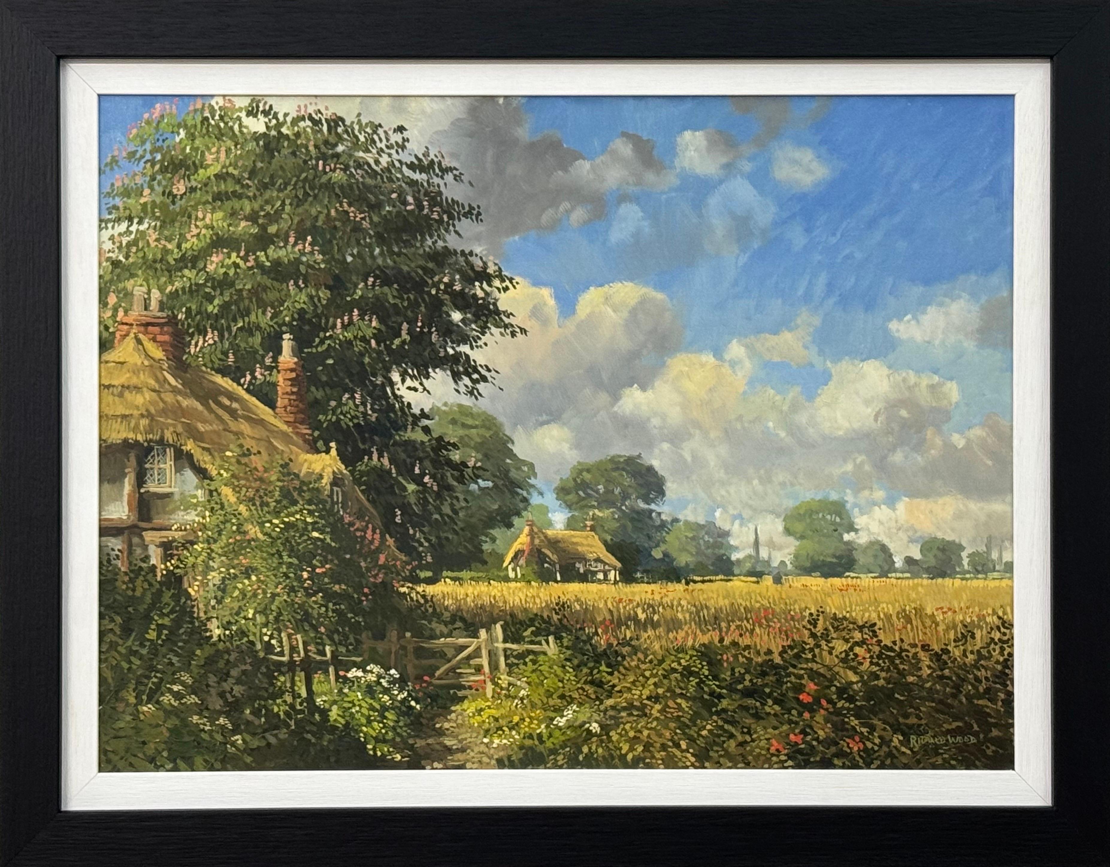 Thatched Cottages with Wild Flowers & Village Church in the English Countryside