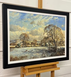 Winter landscape with snow covered fields & farmhouse in the English Countryside