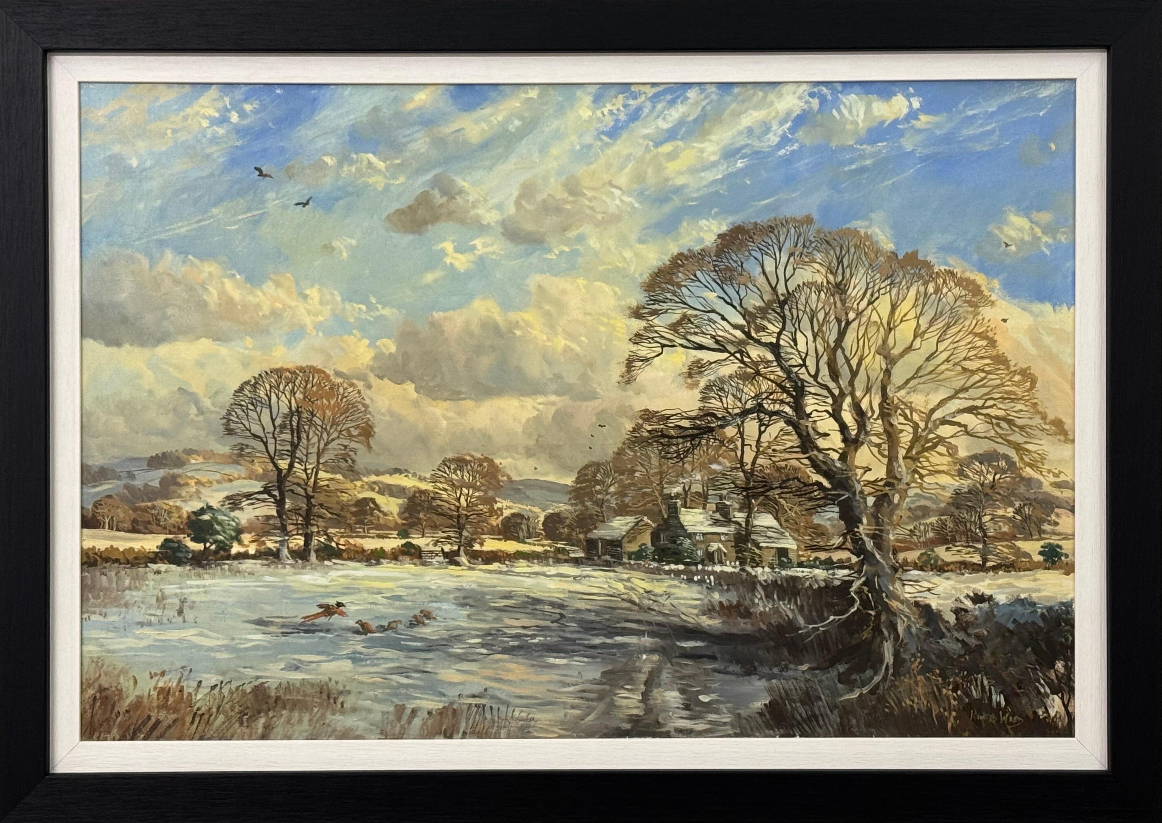 Winter landscape with snow covered fields & farmhouse in the English Countryside